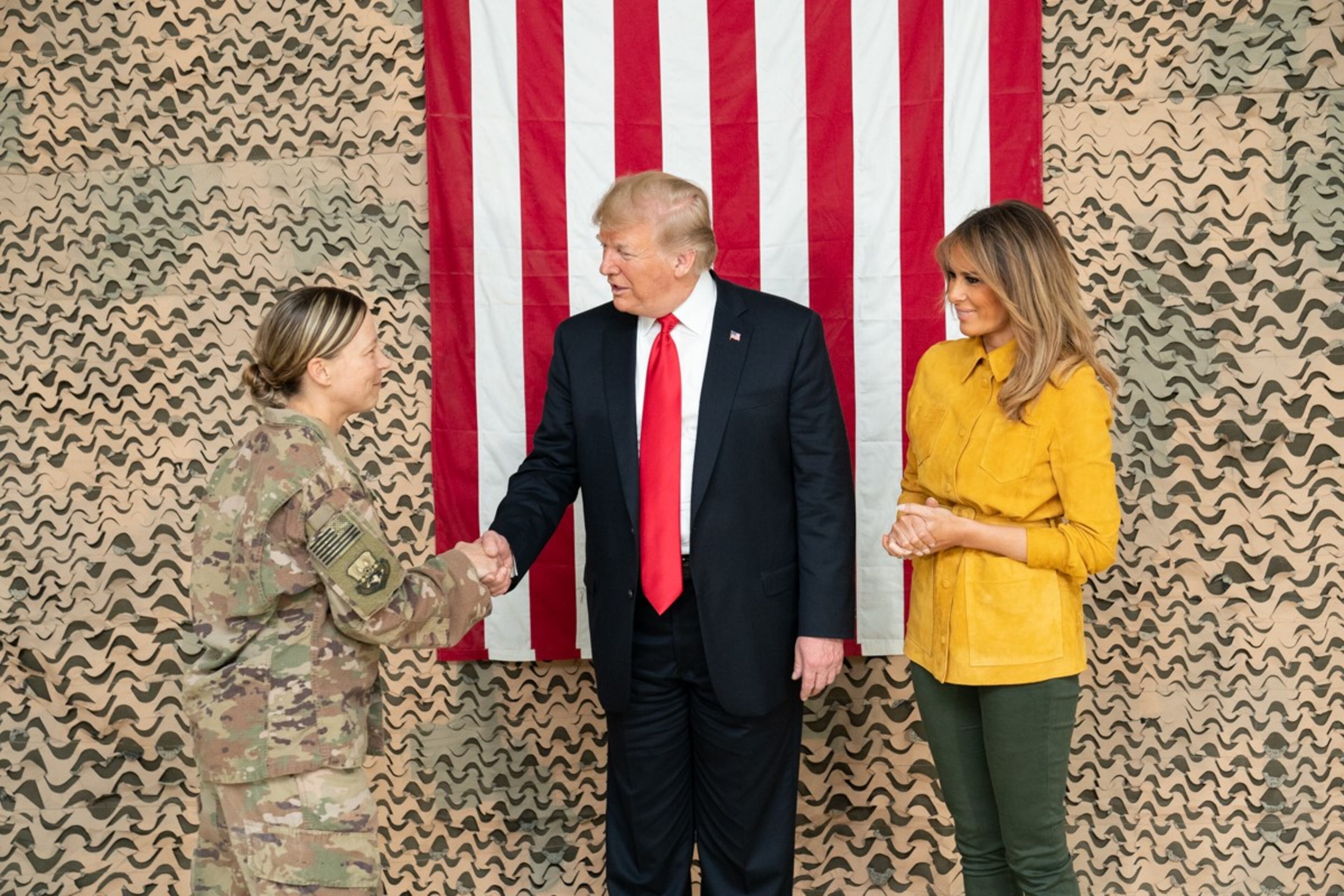 President Donald J. Trump, joined by First Lady Melania Trump, shakes hands and speaks with U.S. military personnel Wednesday, December 26, 2018, at the Al-Asad Airbase in Iraq.
