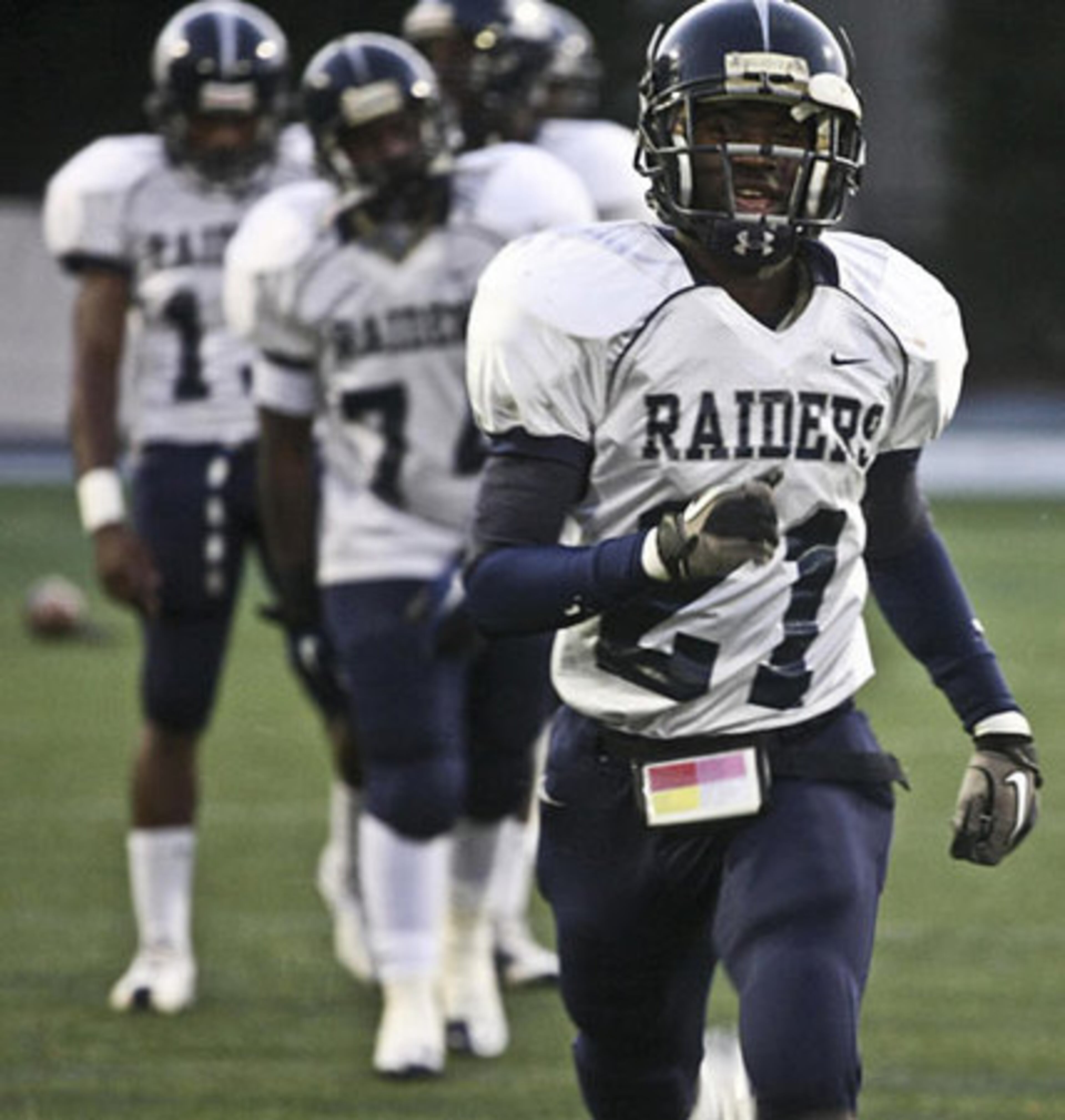 The Redan Raiders run through drills prior to the game against Marist.