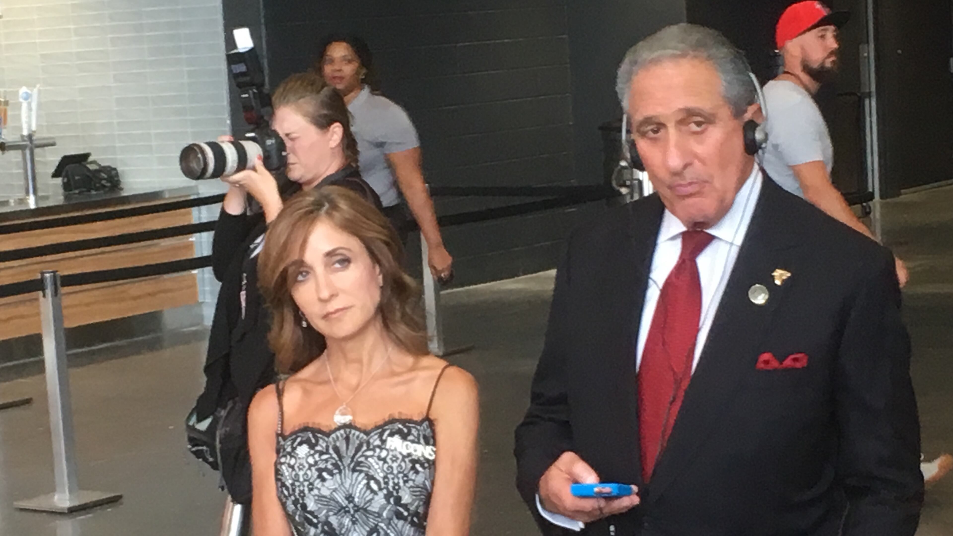 Arthur and Angela Blank listen as a guide leads a tour of artwork at Mercedes-Benz Stadium. Photo: Jennifer Brett