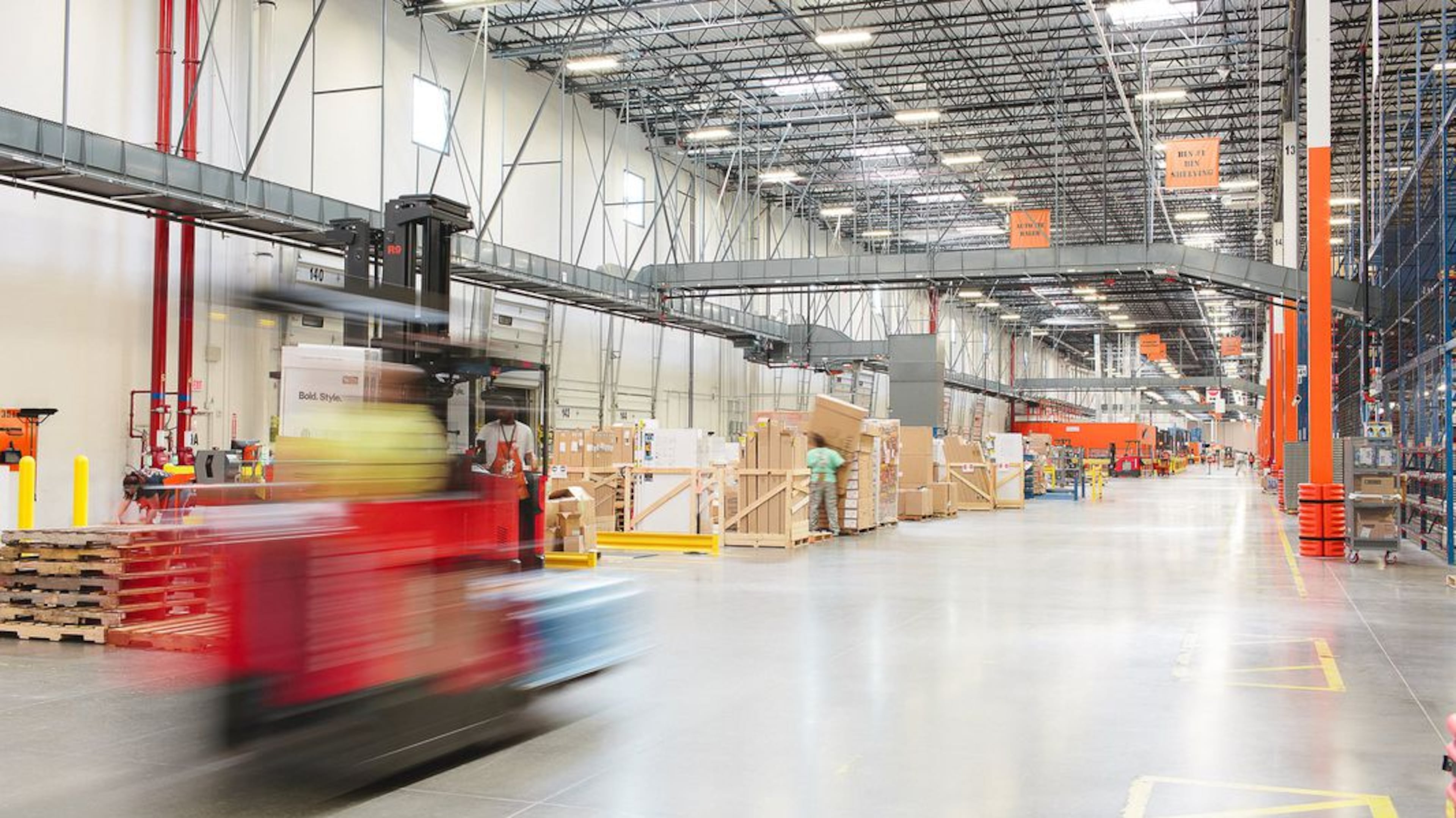 Demand for warehouse workers has meant higher wages and signing bonuses in many places. Here, a Home Depot warehouse distribution center in Locust Grove.