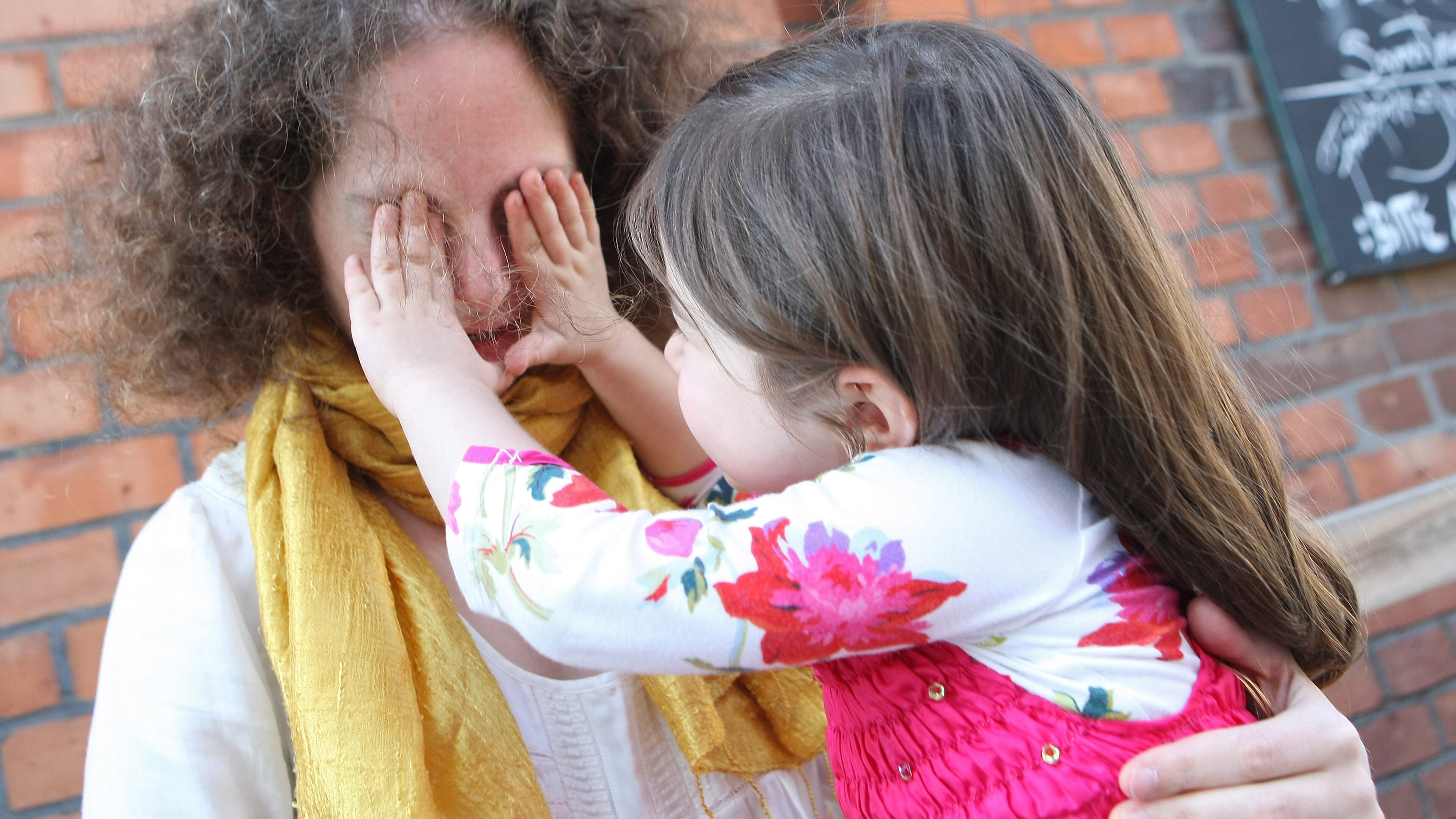 BERLIN, GERMANY - SEPTEMBER 16: A mother and her three-year-old daughter play together on September 16, 2012 in Berlin, Germany. Germany is currently debating the introduction of a nation-wide home child care subsidy (Betreuungsgeld), which would provide parents of one to three-year-old children the option of receiving EUR 150 (196.91 USD) a month to care for the child at home rather than sending him or her to a daycare center. Critics argue it would prevent the integration of children of recent immigrants into German society. (Photo by Adam Berry/Getty Images)
