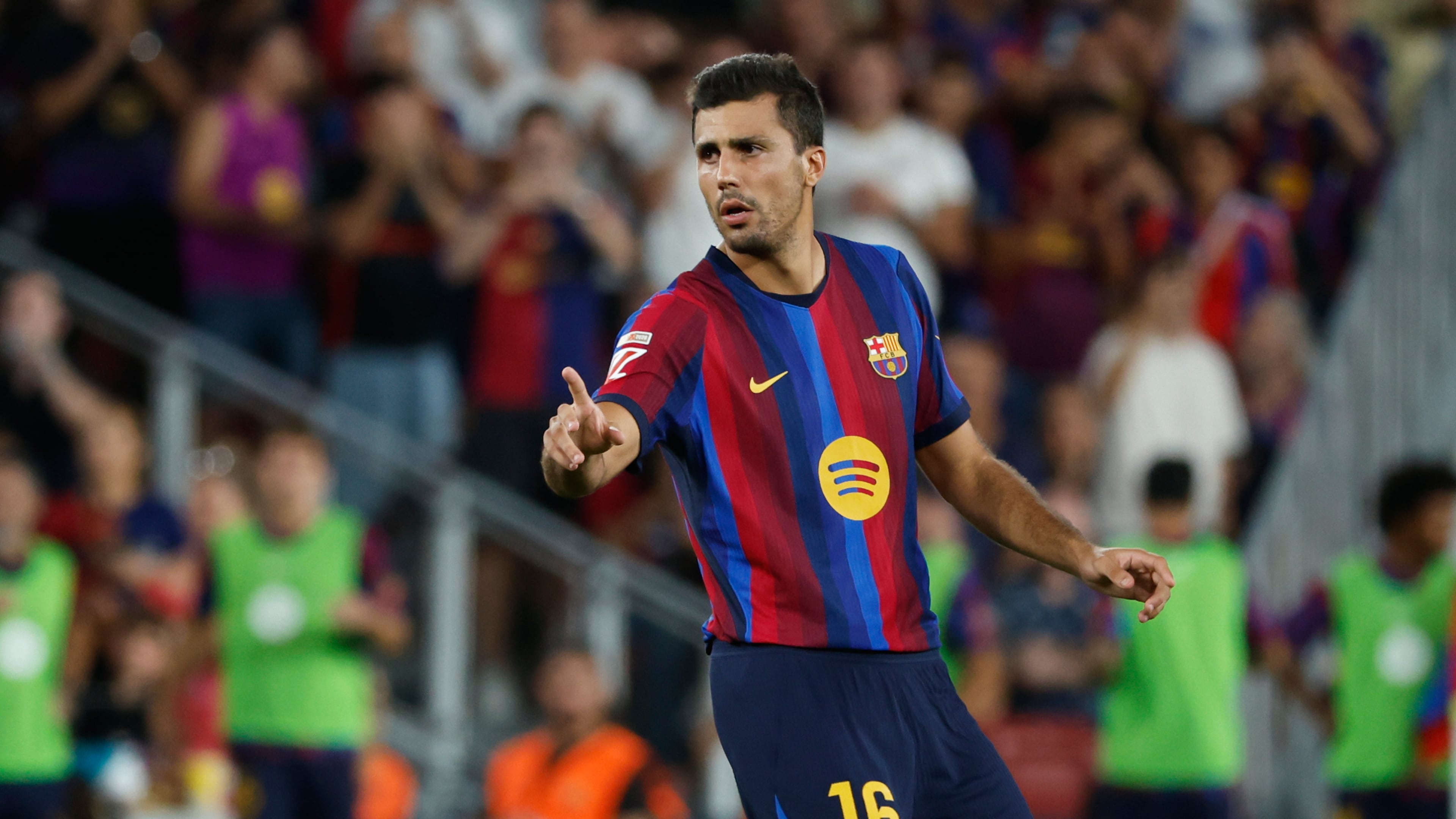 Barcelona's Rodrigo gestures during a Spanish La Liga soccer match between Barcelona and Athletic in Barcelona, Spain, Thursday, Aug. 27, 2026. (AP Photo/Joan Monfort)