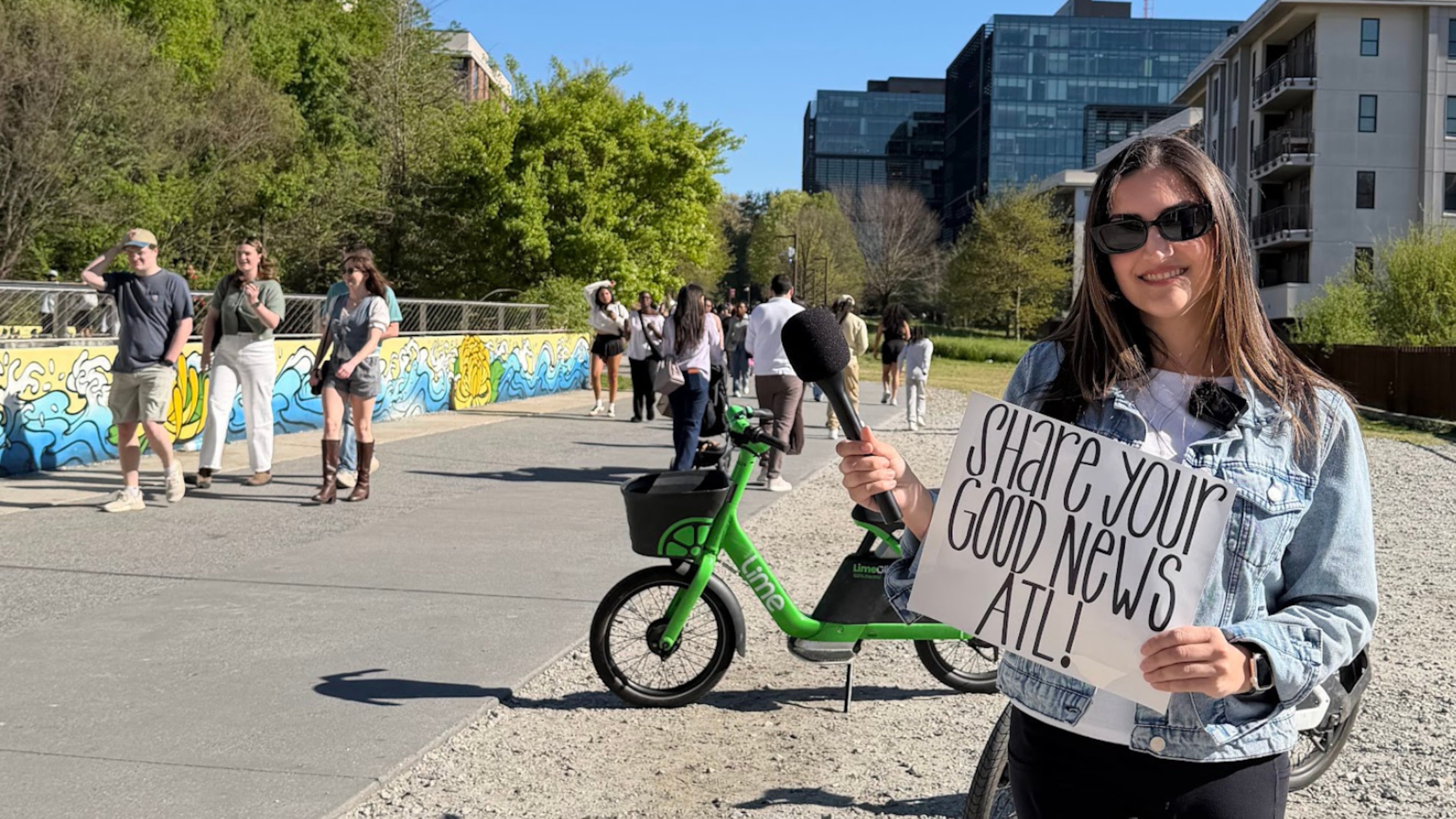 Atlanta native Catherine Catoura invites pedestrians along the Beltline to share their goods news. (Courtesy of Catherine Catoura)