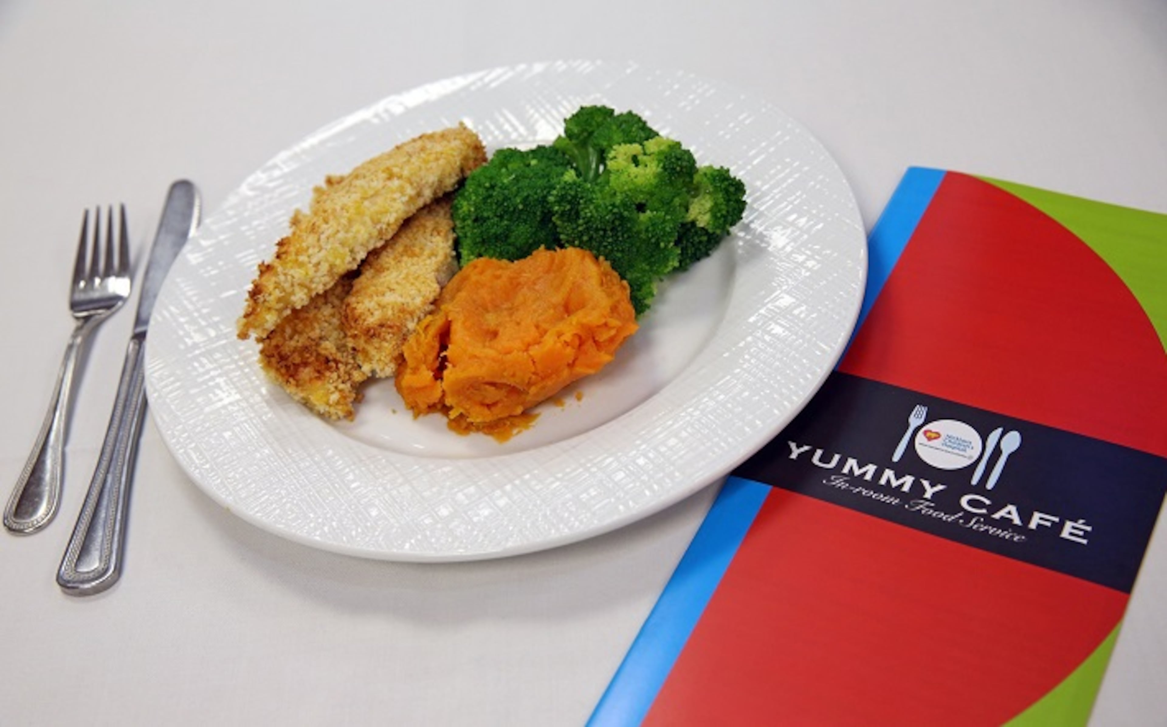 One of the lunch/dinner choices at at Jack Nicklaus Children's Hospital includes homemade chicken tenders (baked) with optional side dishes that include sweet potatoes and broccoli. (Emily Michot/Miami Herald/TNS)