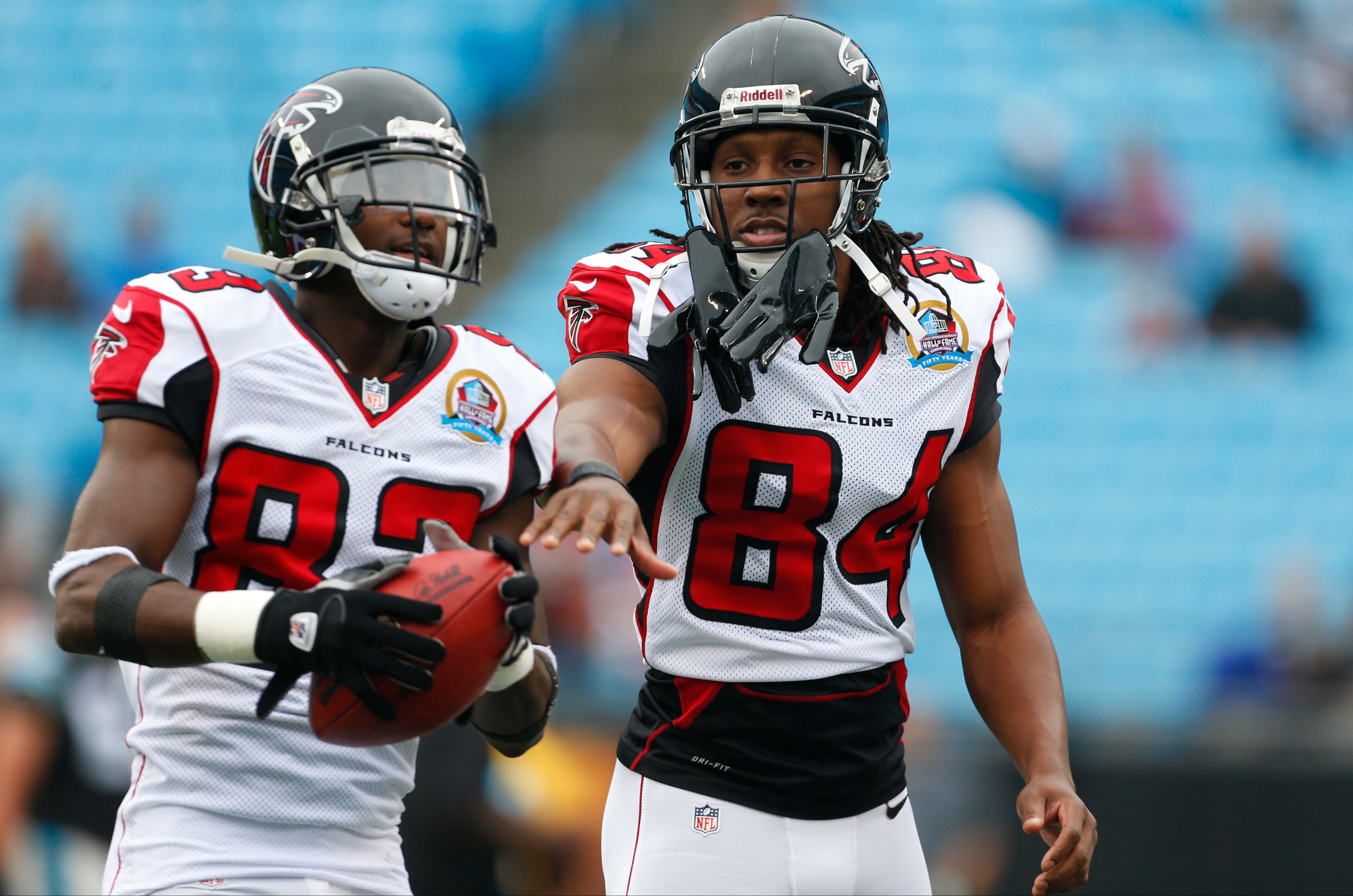 Atlanta Falcons' Roddy White (84) and Harry Douglas (83) joke as they warm up before an NFL football game against the Carolina Panthers in Charlotte, N.C., Sunday, Dec. 9, 2012.