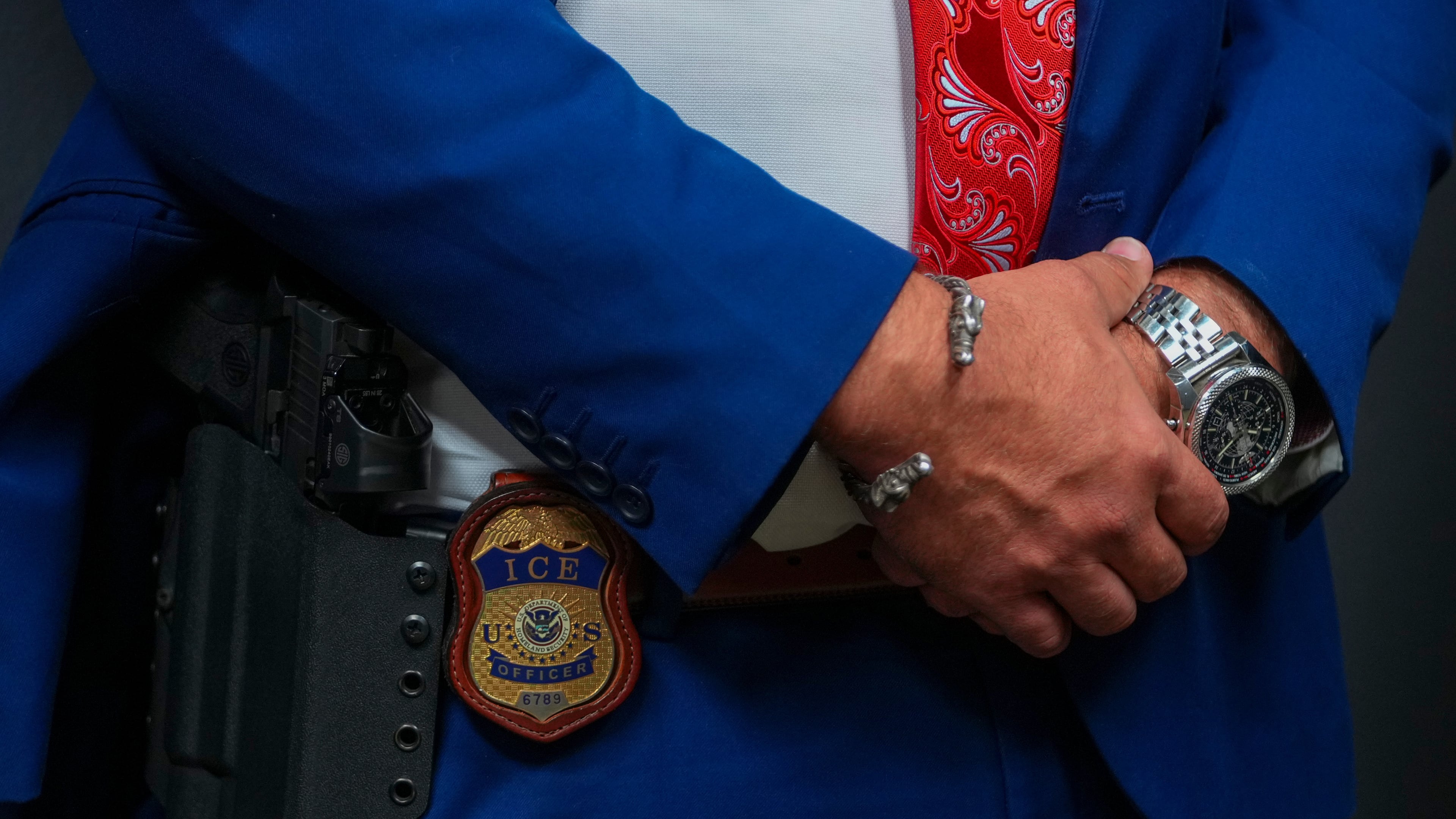FILE - An Immigration and Customs Enforcement officer's badge is visible during an ICE hiring fair, Aug. 26, 2025, in Arlington, Texas. (AP Photo/Julio Cortez, File)