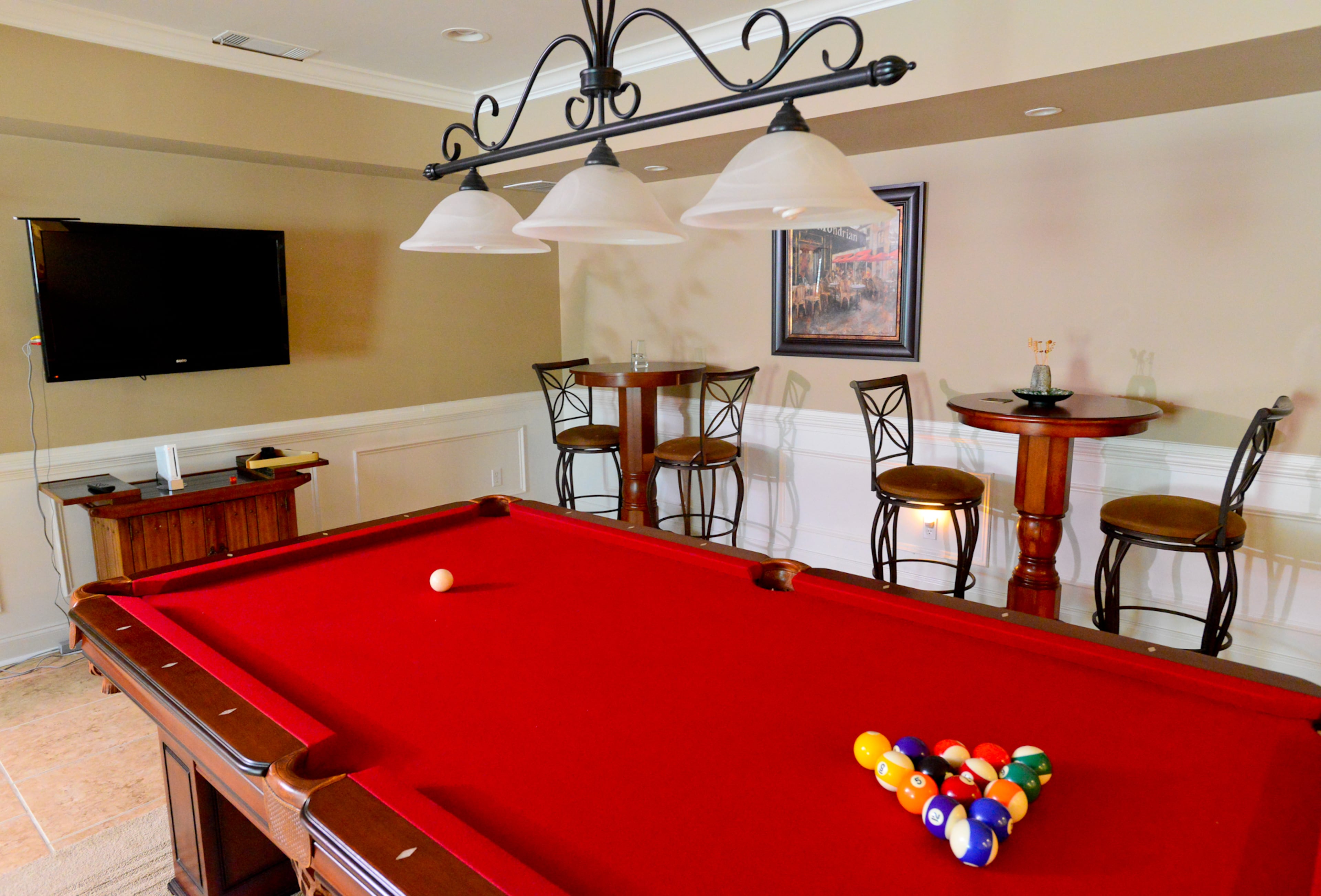 Frances Pace gave her husband Garnell the pool table as a gift. The table is from Rec Warehouse in Norcross, and the cafe tables and stools were bought while on sale at Garden Ridge.