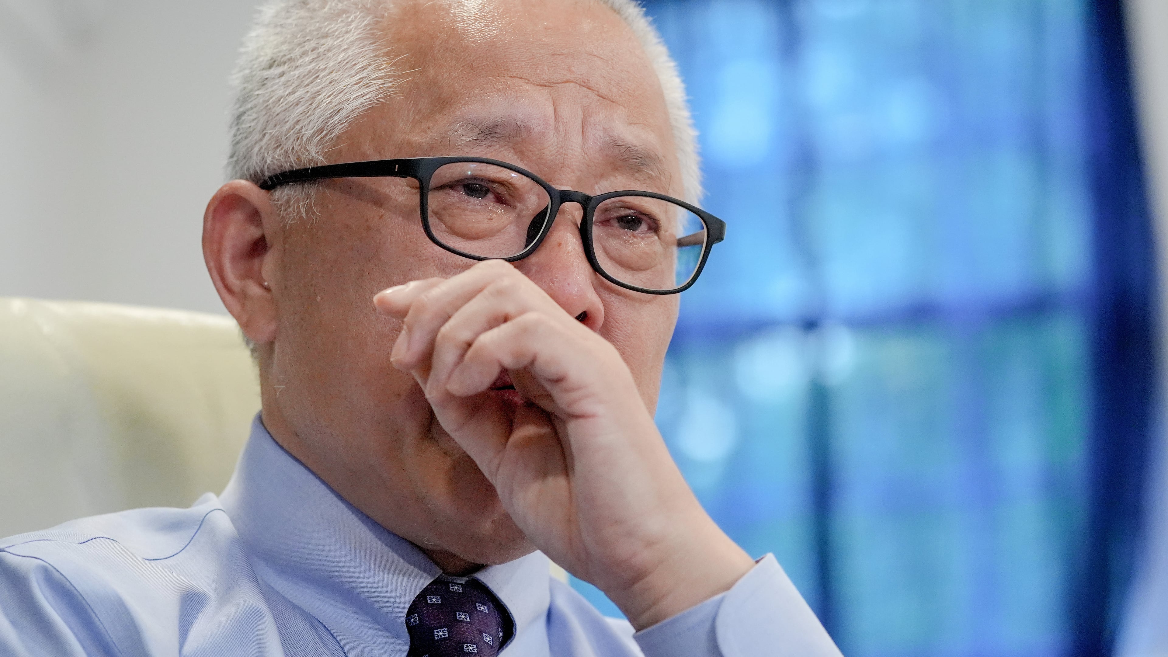 Chinese pastor Ezra Jin Mingri becomes emotional during an interview with The Associated Press in Maryland, Wednesday, July 22, 2026 . (AP Photo/Mariam Zuhaib)