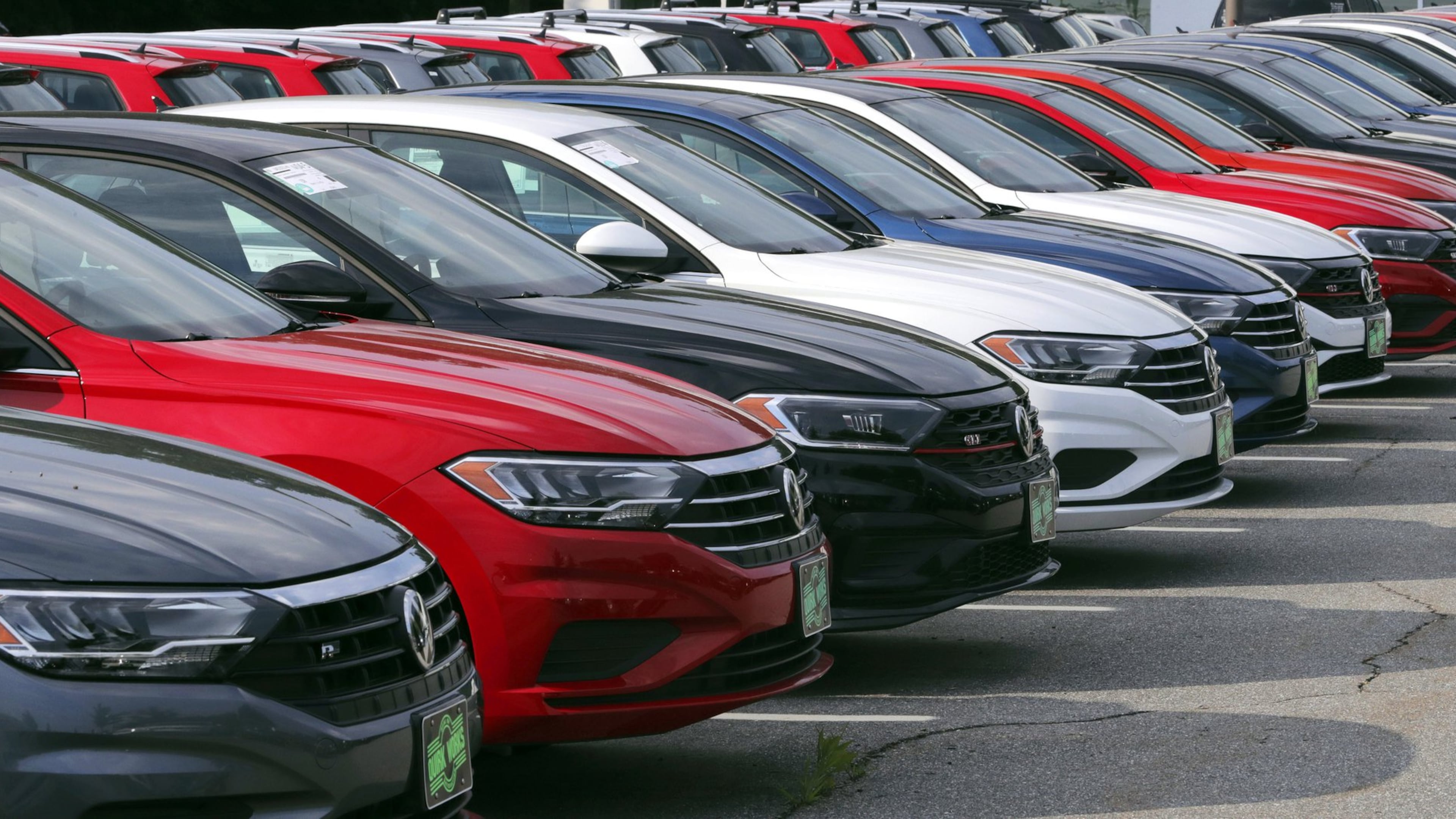 In this July 10, 2019, photo Volkswagen Jetta sedans are lined up at the Quirk dealership in Manchester, N.H. (AP Photo/Charles Krupa)