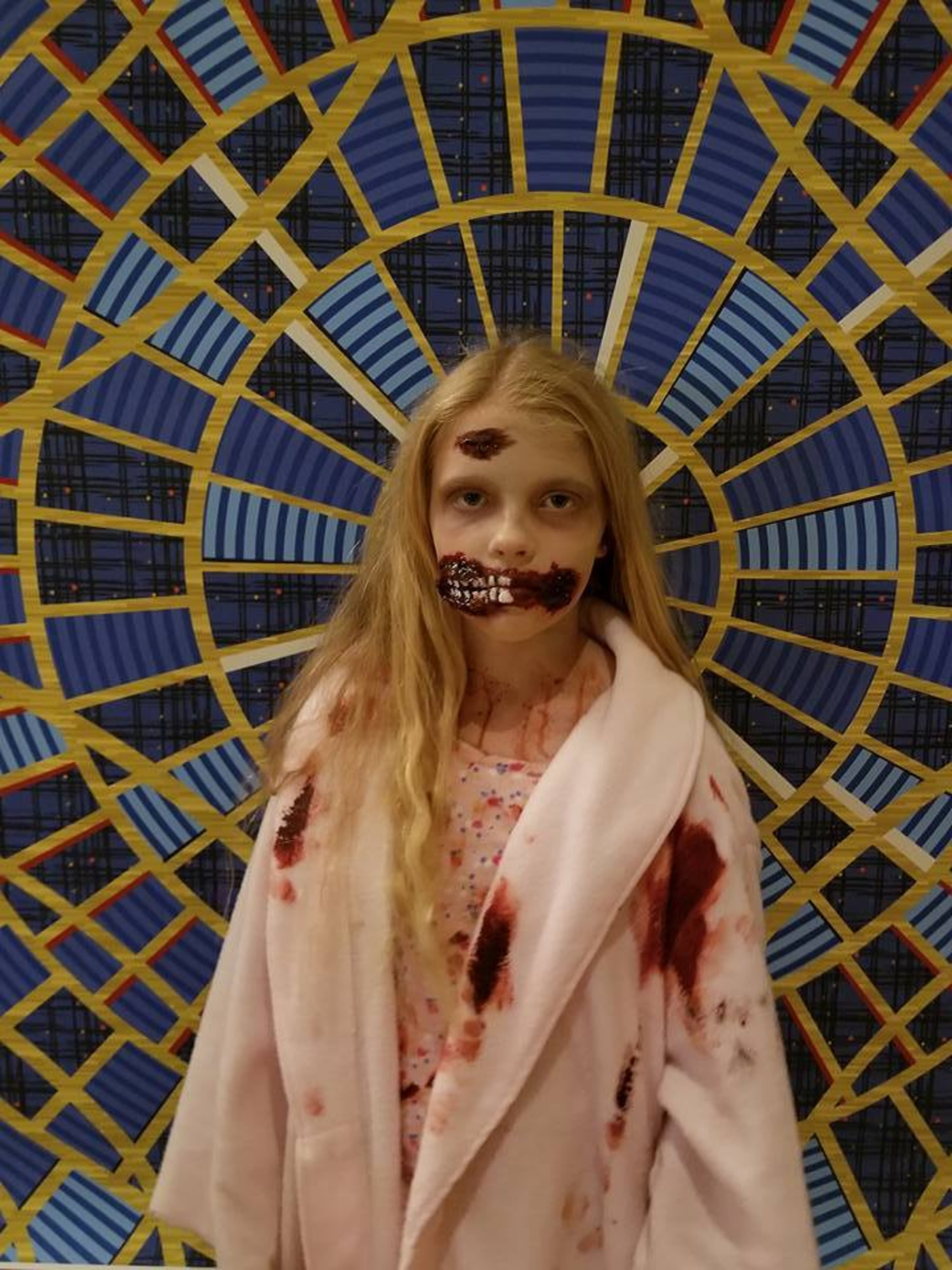 Sydney Samples, dressed as a zombie from “The Walking Dead,” wears makeup that her parents Ryan and Jill learned to do on YouTube. (Courtesy of Ryan Samples)