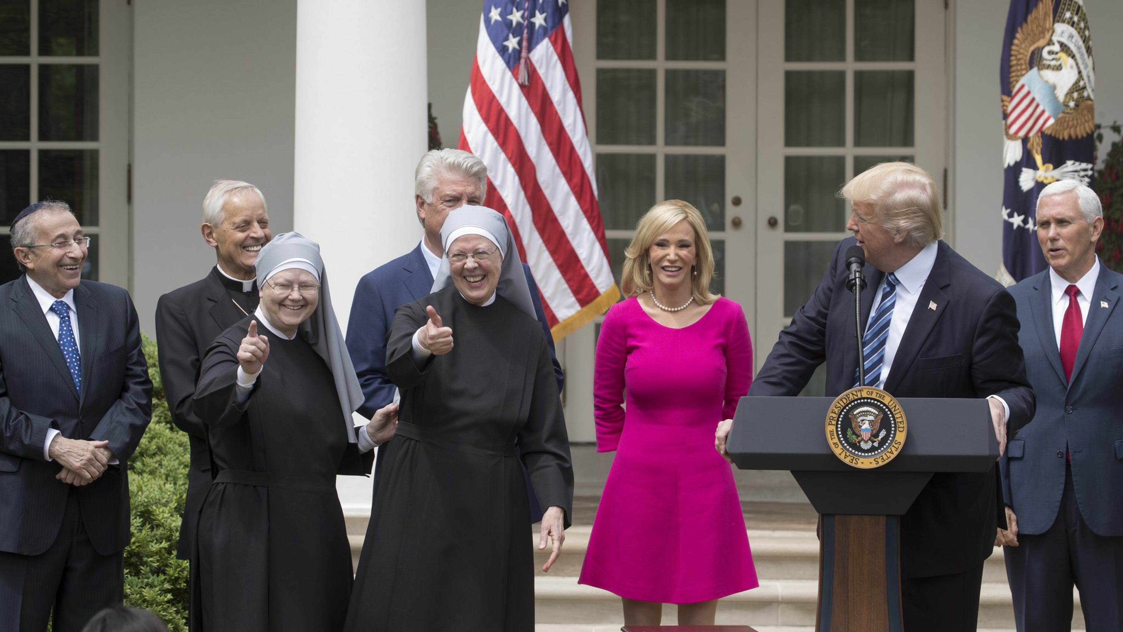 Nuns with the Little Sisters of the Poor give a thumbs up at a National Day of Prayer event with President Donald Trump and other religious leaders in the Rose Garden at the White House, in Washington, May 4, 2017. At the event Trump signed an executive order aimed at easing restrictions on political activity by tax-exempt churches and charities. (Stephen Crowley/The New York Times)