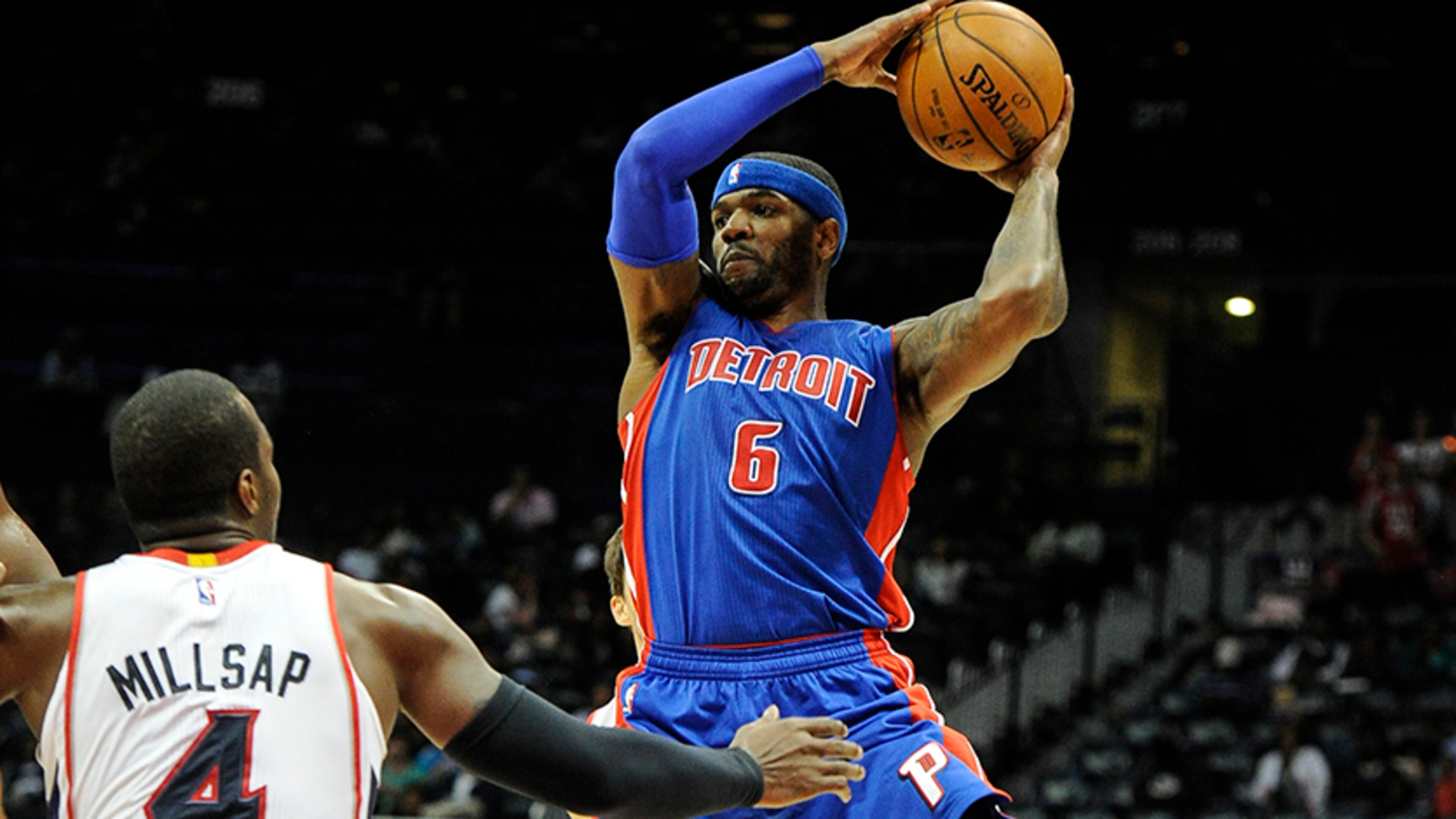 Pistons forward Josh Smith (6) goes up against Hawks forward Paul Millsap (4) during the second half of a preseason NBA basketball game, Saturday, Oct., 18, 2014, in Atlanta. Detroit won 104-100.
