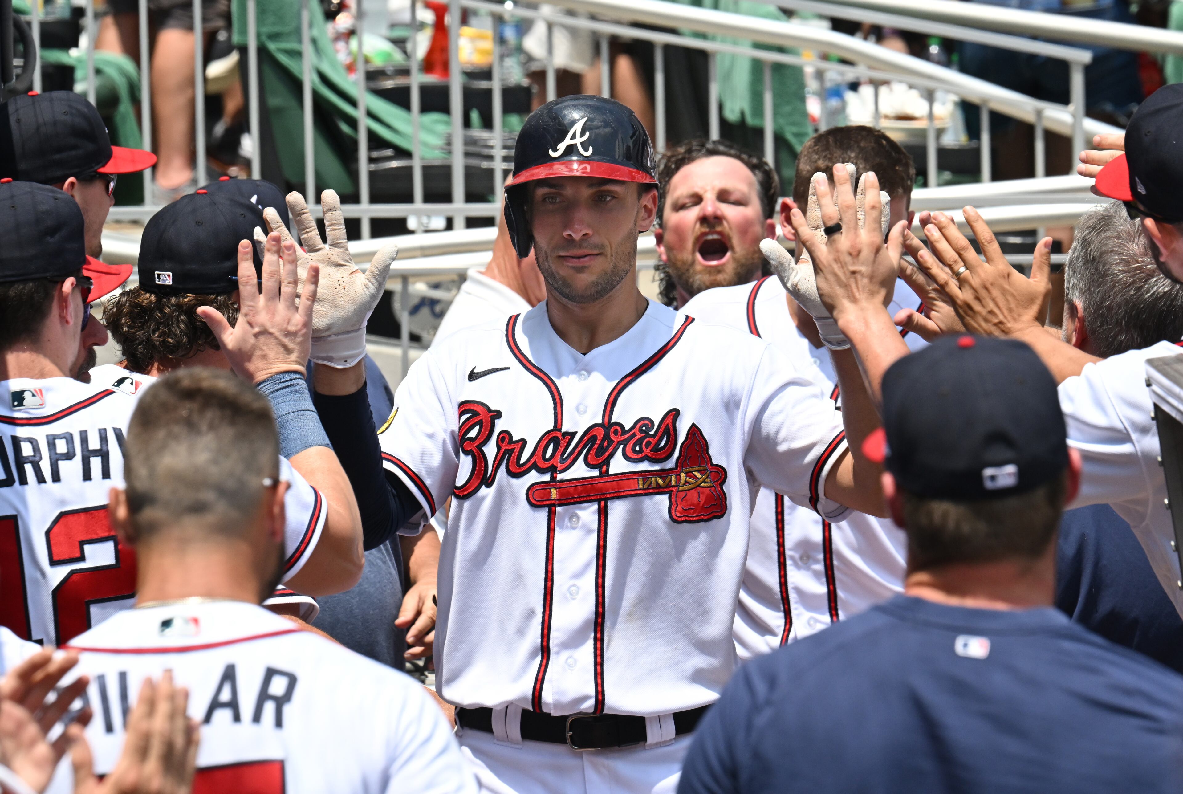 Braves first baseman Matt Olson (28) celebrates with teammates after hitting a solo home run during the eighth inning. (Hyosub Shin / Hyosub.Shin@ajc.com)