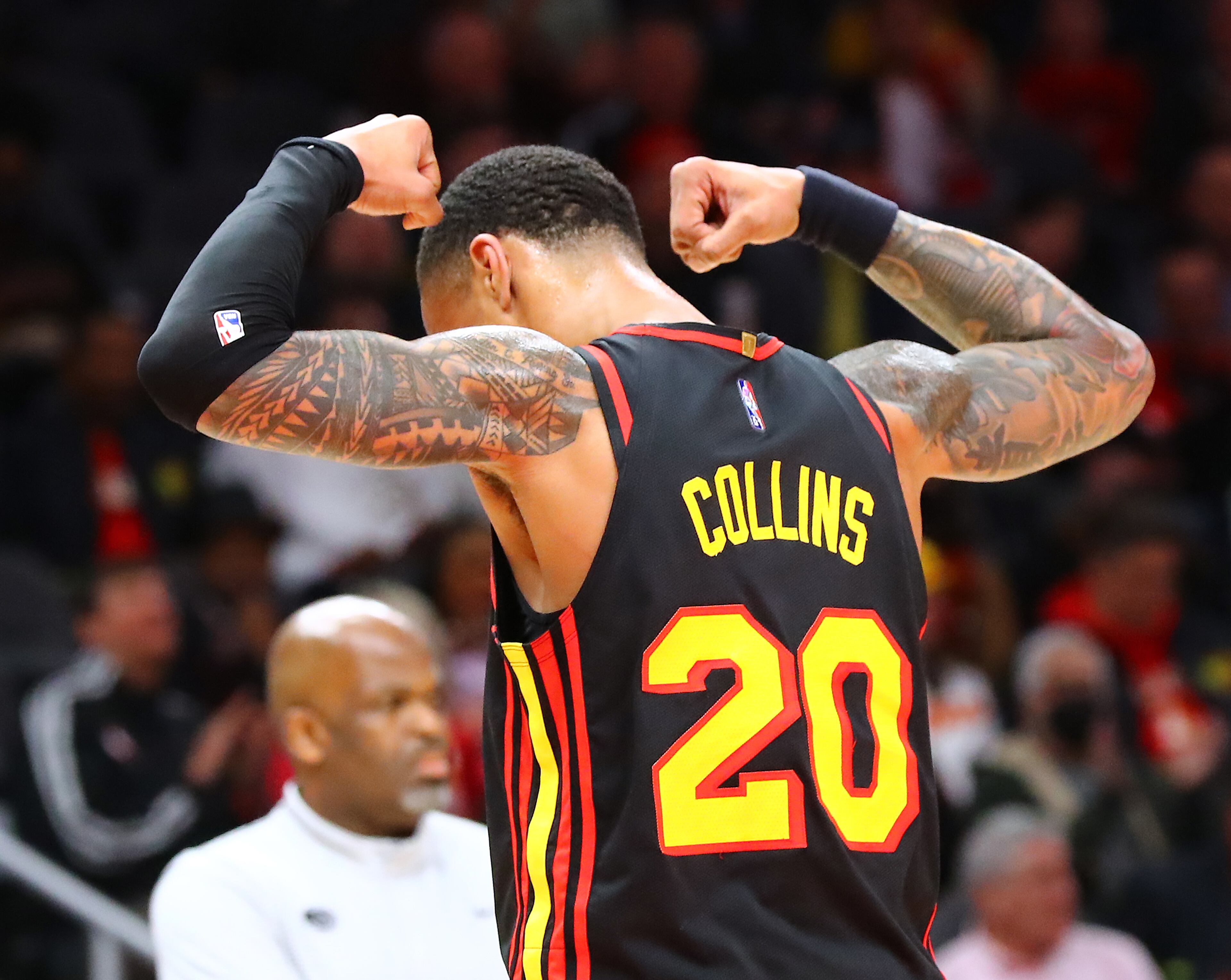 Hawks forward John Collins flexes after slamming against the Indiana Pacers during the first period in an NBA game on Tuesday, Feb. 8, 2022, in Atlanta. “Curtis Compton / Curtis.Compton@ajc.com”`