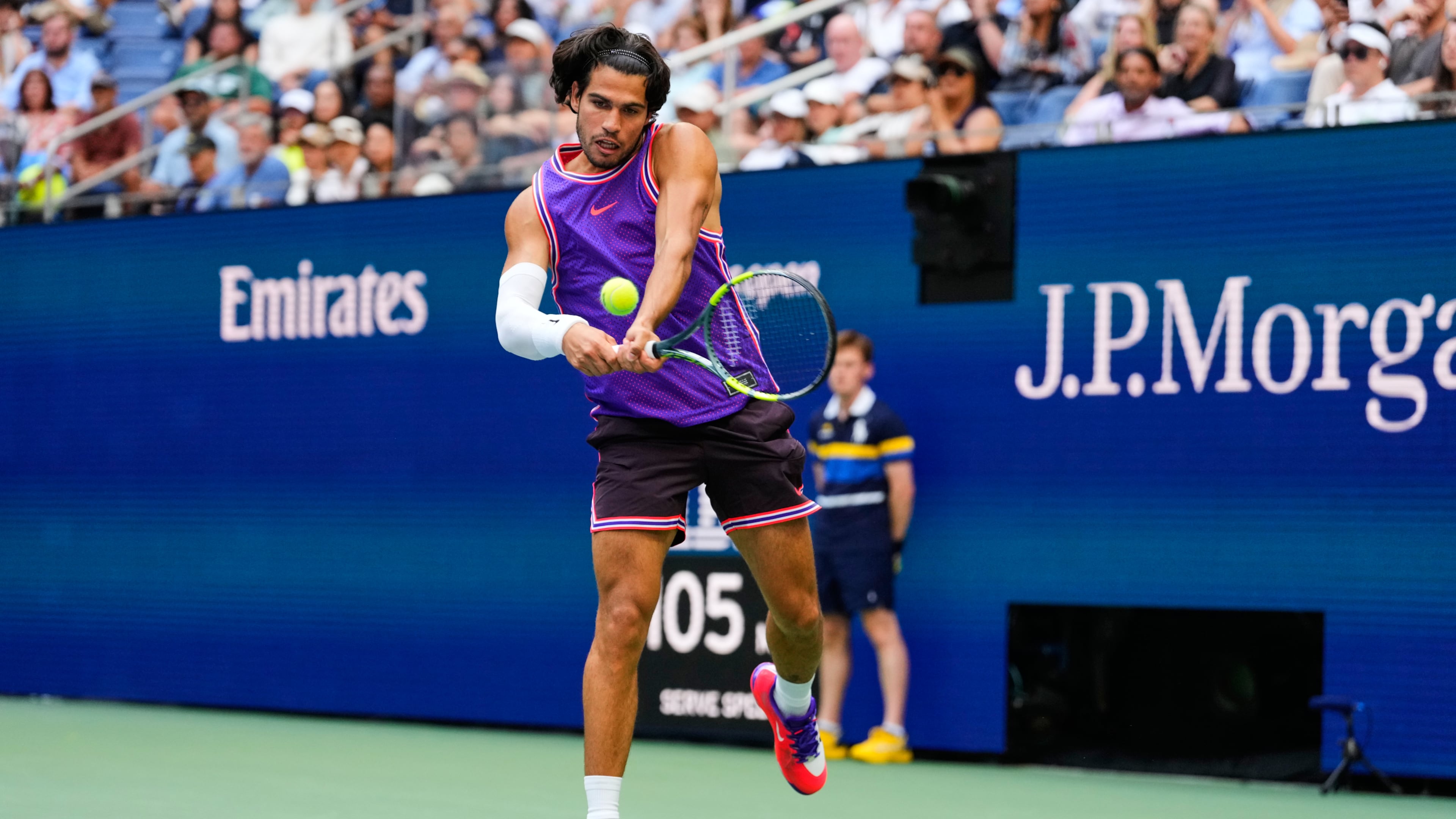Carlos Alcaraz, of Spain, returns the ball during a mixed doubles match at the U.S. Open tennis championships, Tuesday, Aug. 25, 2026, in New York. (AP Photo/Yuki Iwamura)