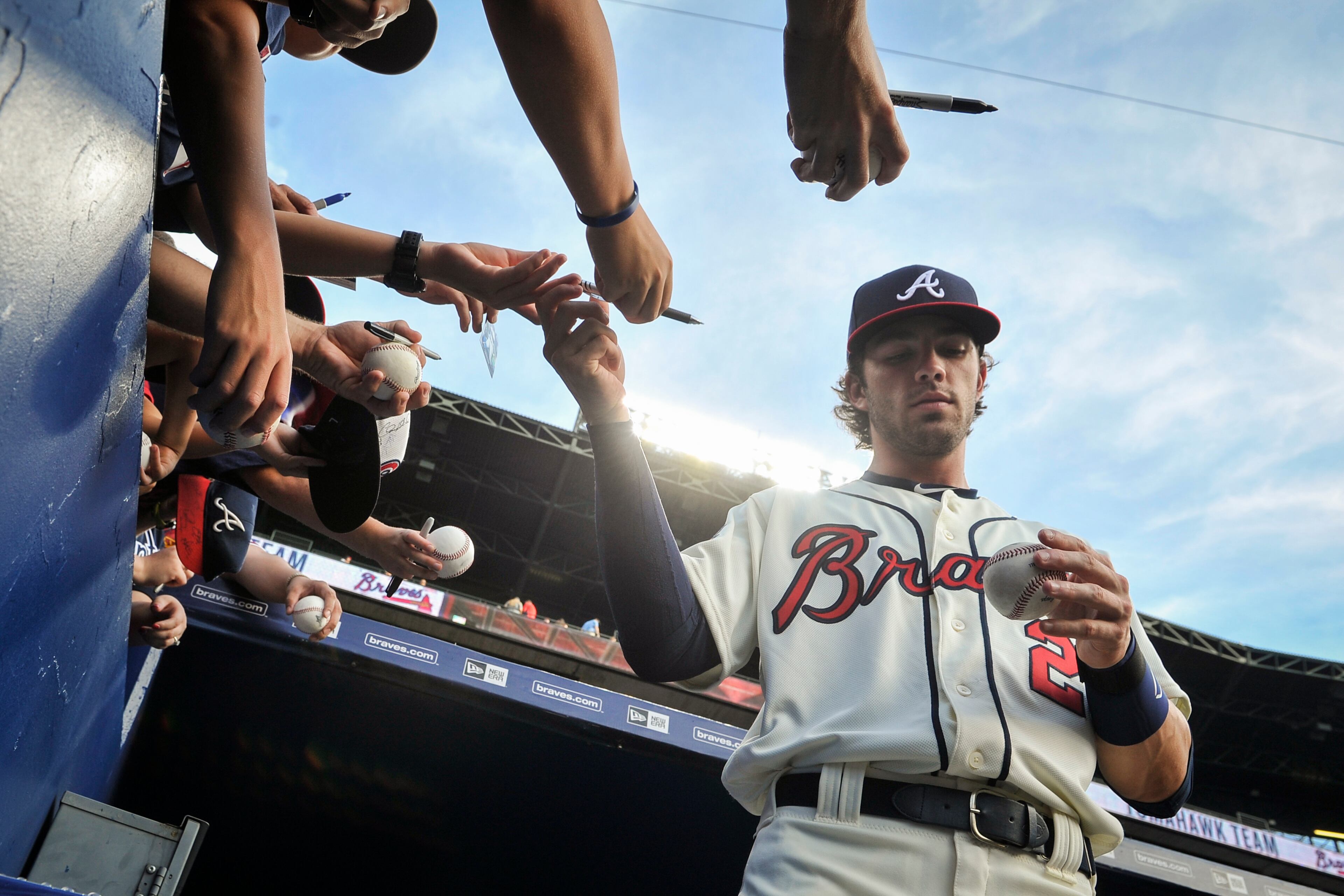 Atlanta Braves Dansby Swanson signs autographs before a baseball game against the Washington Nationals, Saturday, Aug. 20, 2016, in Atlanta. (AP Photo/John Amis)