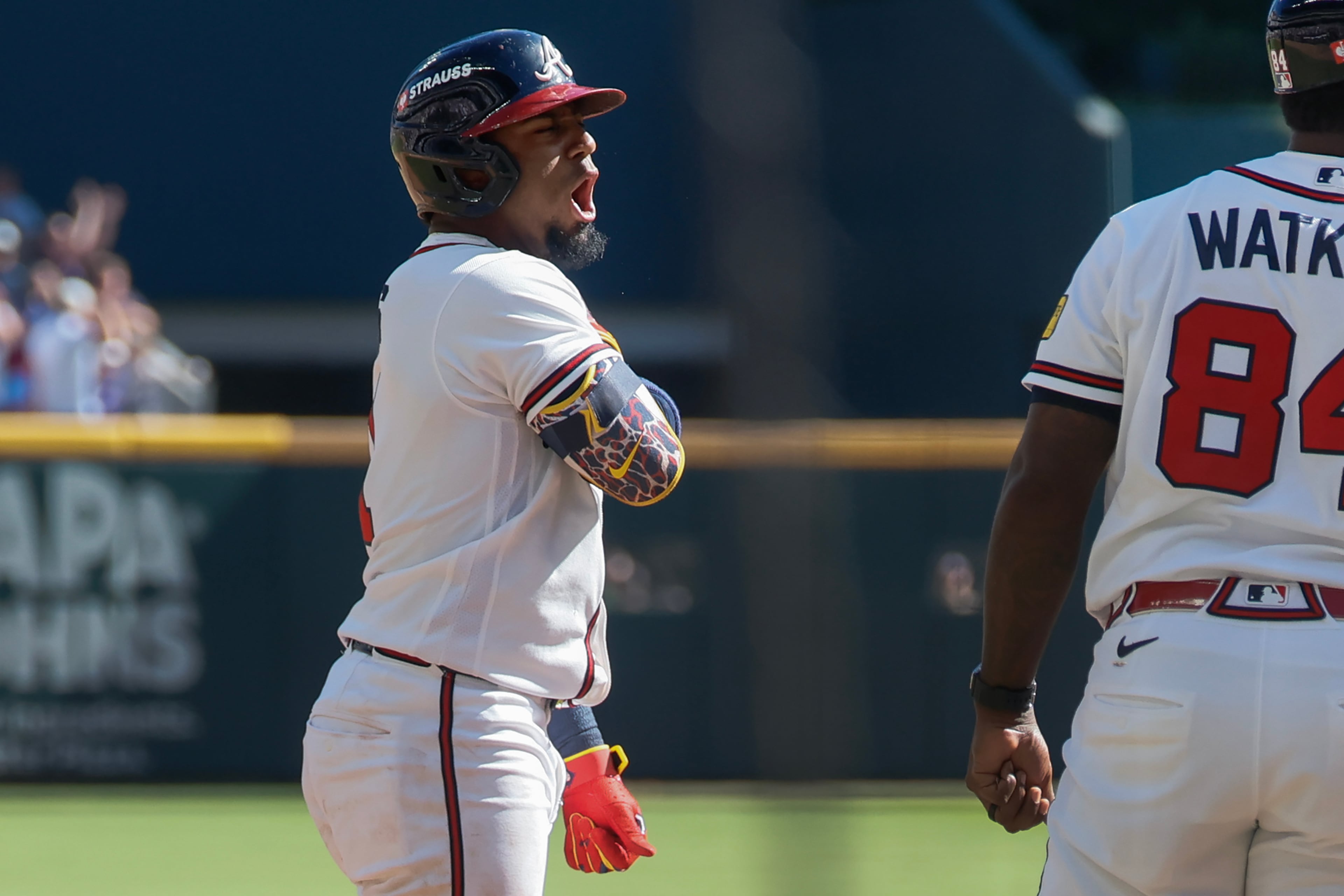 Atlanta Braves' Ozzie Albies reacts after hitting an RBI triple against the Philadelphia Phillies during the sixth inning of Game 1 of a MLB National League Wild Card playoff series between the Atlanta Braves and the Philadelphia Phillies, Tuesday, Sept. 29, 2026, in Atlanta. (Miguel Martinez/AJC)