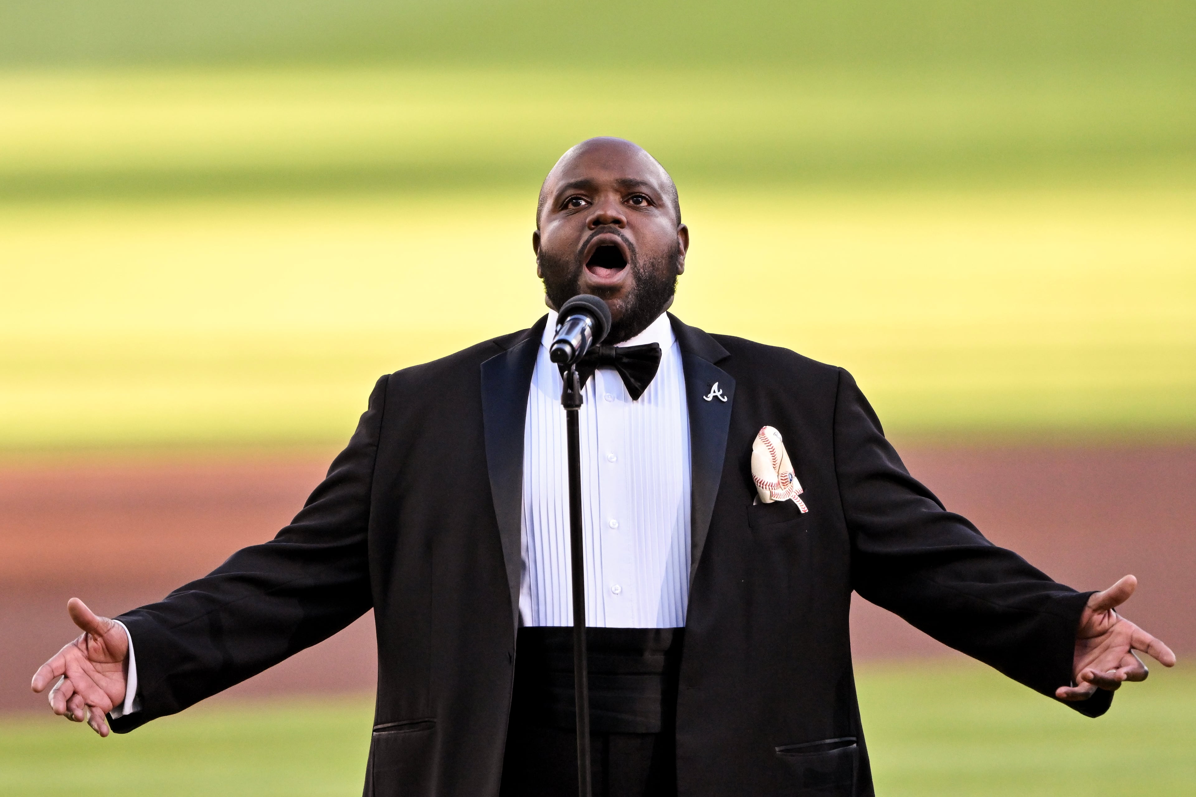 Timothy Miller sings the US national anthem before Game 4 of the MLB National League Division Series between the Atlanta Braves and the Los Angeles Dodgers, Wednesday, Oct. 7, 2026, in Atlanta. (Hyosub Shin/AJC)