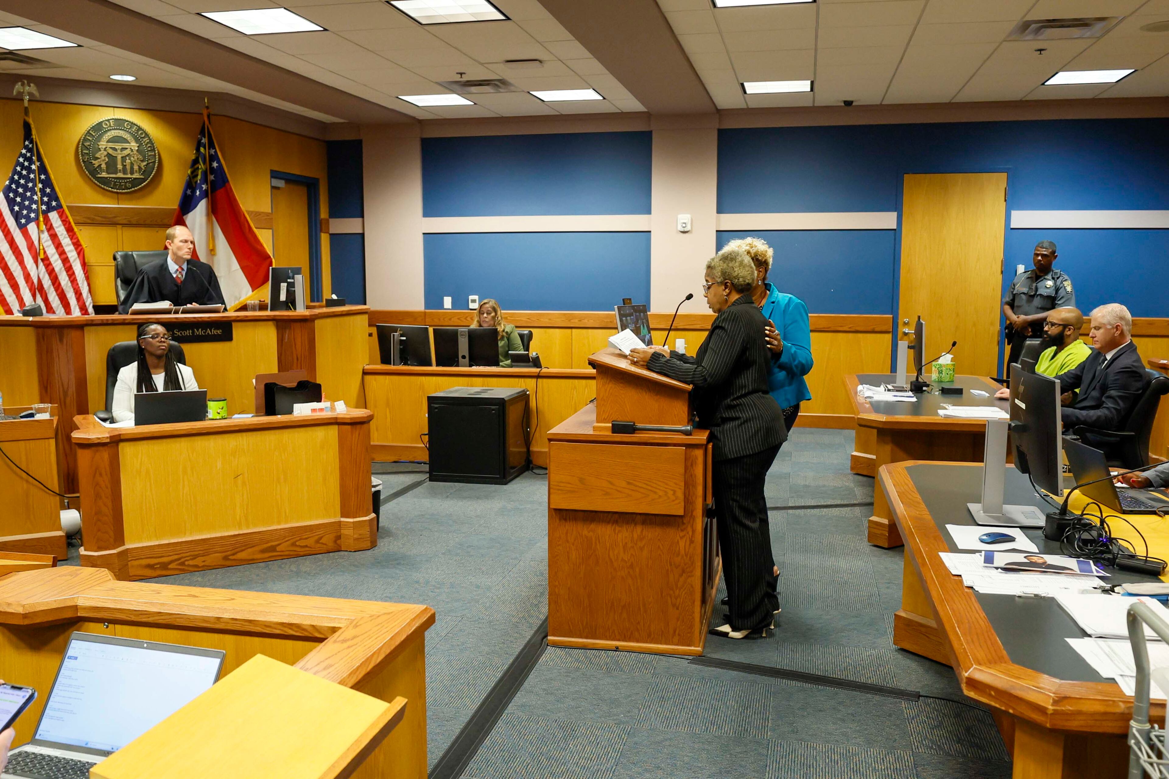 Marchelle Folks, mother of the late Reginald Folks, wipes away tears as he speaks to Fulton County Superior Court Judge Scott McAfee on Tuesday during the sentencing of former APD officer Koby Minor, who killed her son in May 2024. (Miguel Martinez / AJC)