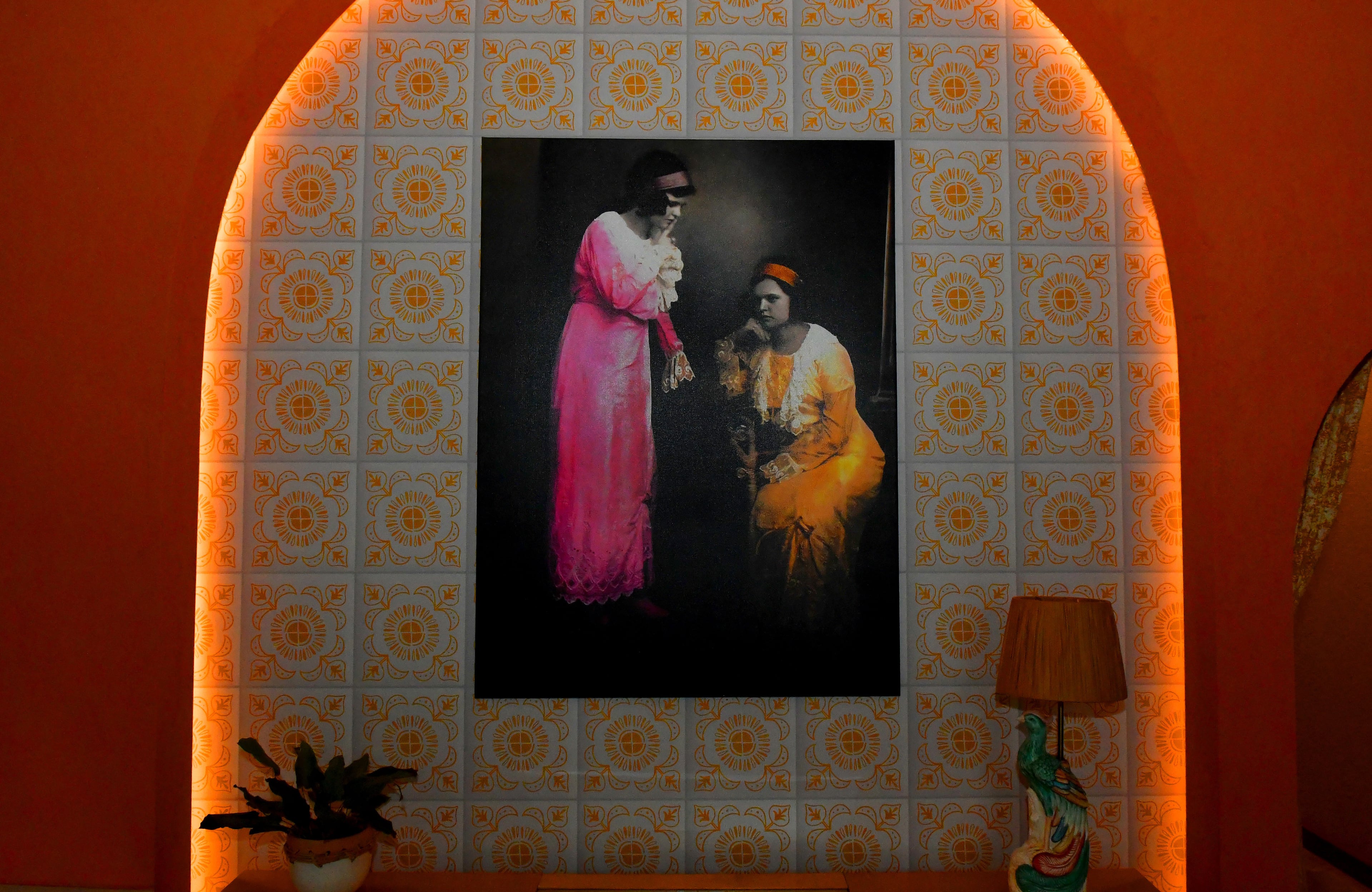 Artwork in the dining room of La Semilla was created from a hand-colored photo of Sophia Trapani's great great grandmother, Abuela Adela, taken by her mother Josefina Potn. (CHRIS HUNT FOR THE ATLANTA JOURNAL-CONSTITUTION)