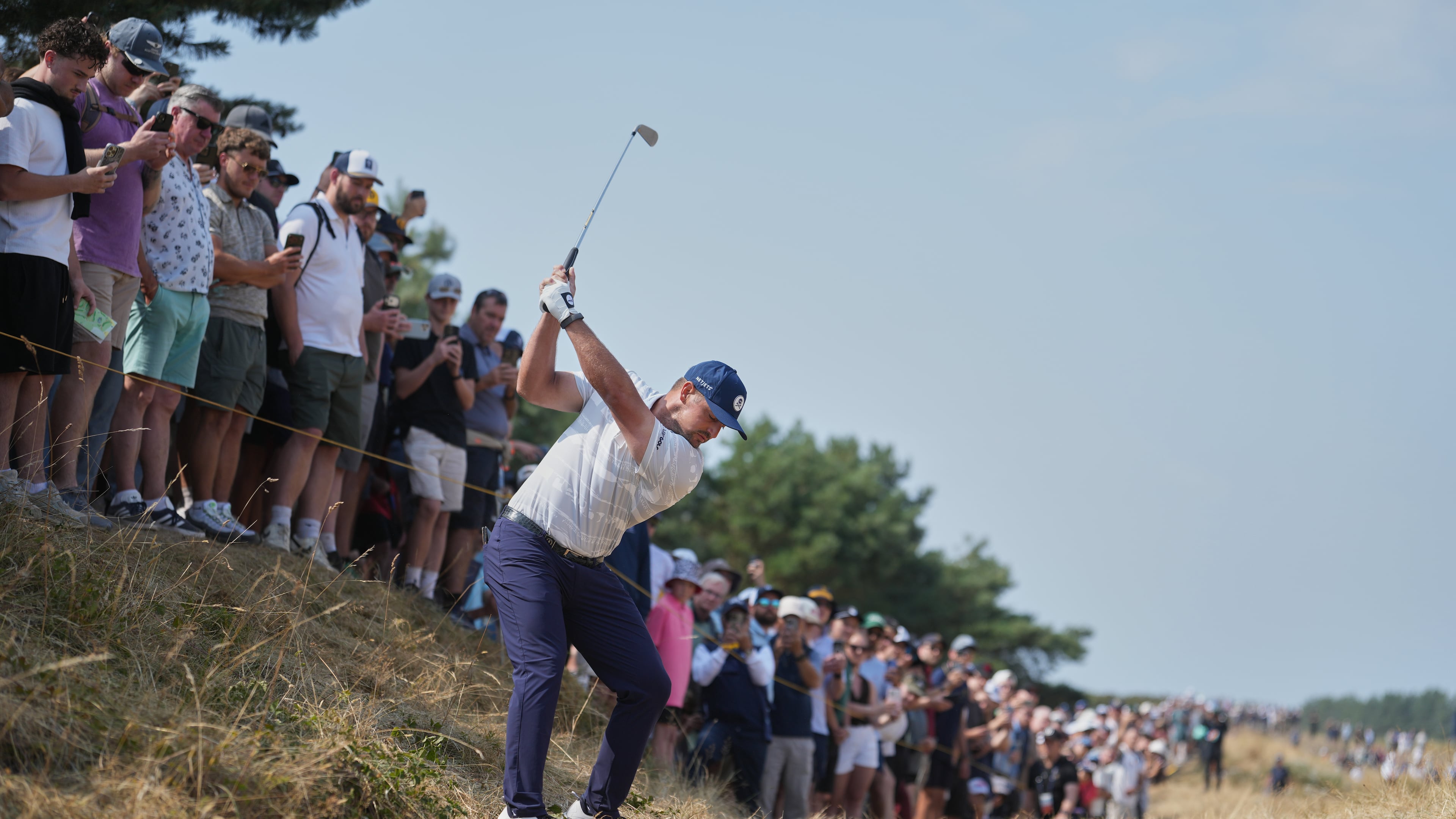 Bryson DeChambeau of the United States plays from the rough on the 1st hole during the third day of the British Open Golf championships at Royal Birkdale golf club, in Southport, England, Saturday, July 18, 2026. (AP Photo/Jon Super)