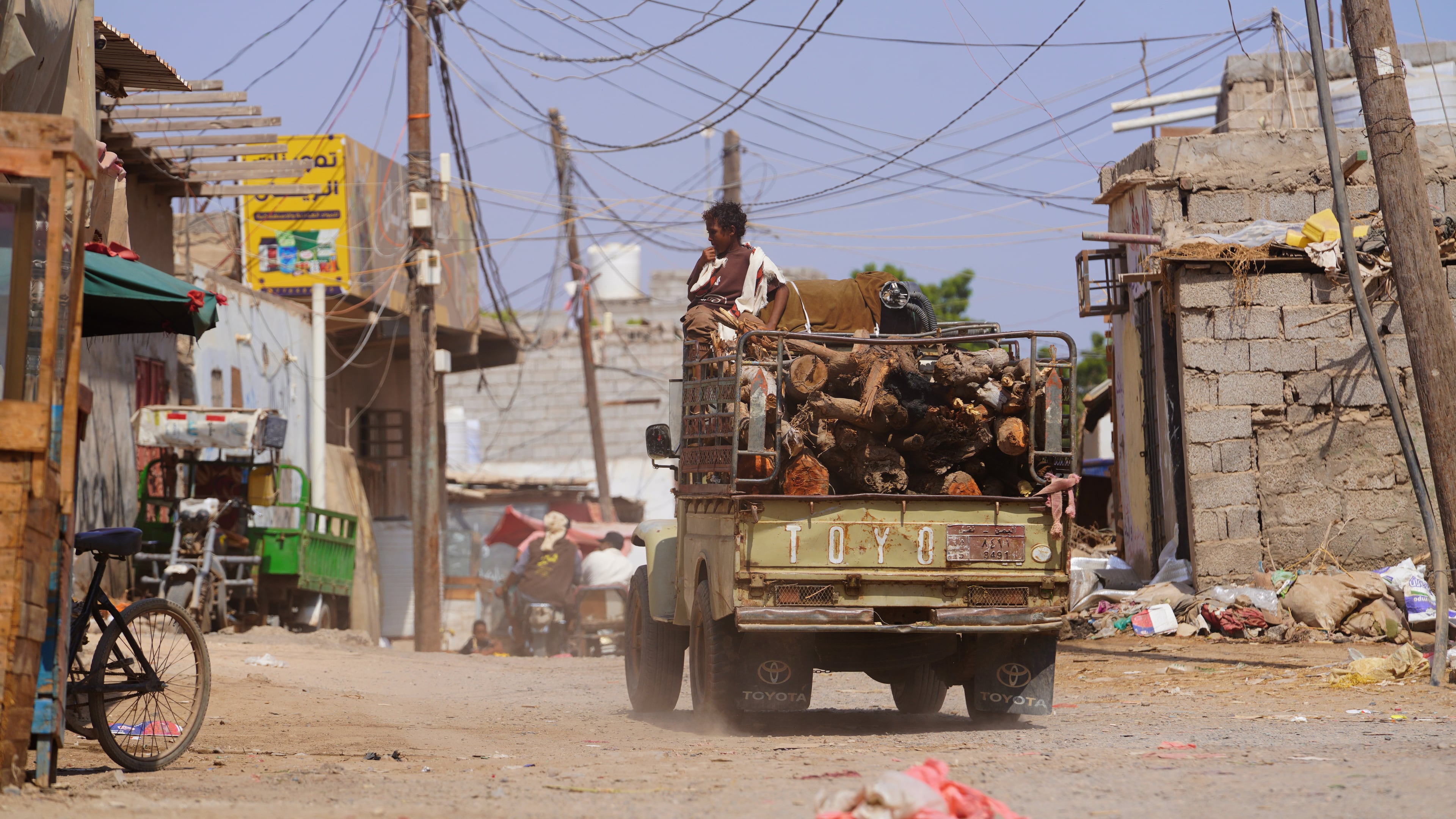 A truck loaded with firewood drives through the Al-Basateen neighborhood in Aden, Yemen, Tuesday, Oct. 13, 2026. (AP Photo/Abdulnasser Alseddik)