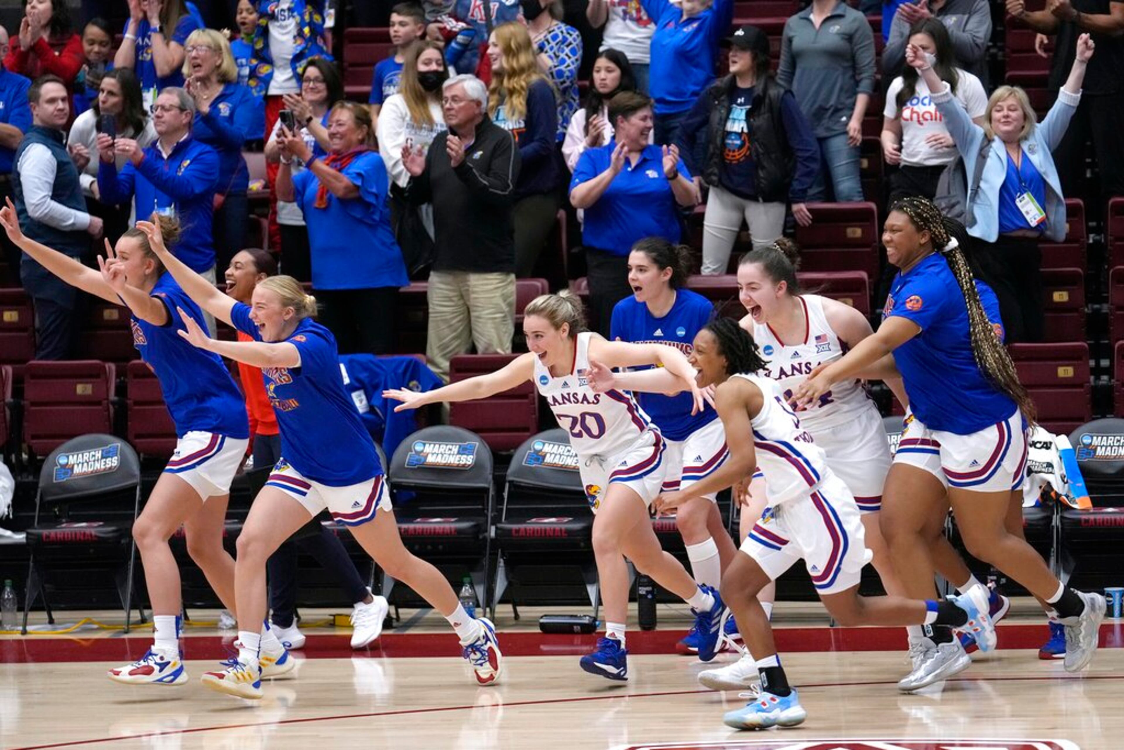 Kansas players celebrate after defeating Georgia Tech of a first-round game in the NCAA women's college basketball tournament Friday, March 18, 2022, in Stanford, Calif. (AP Photo/Tony Avelar)