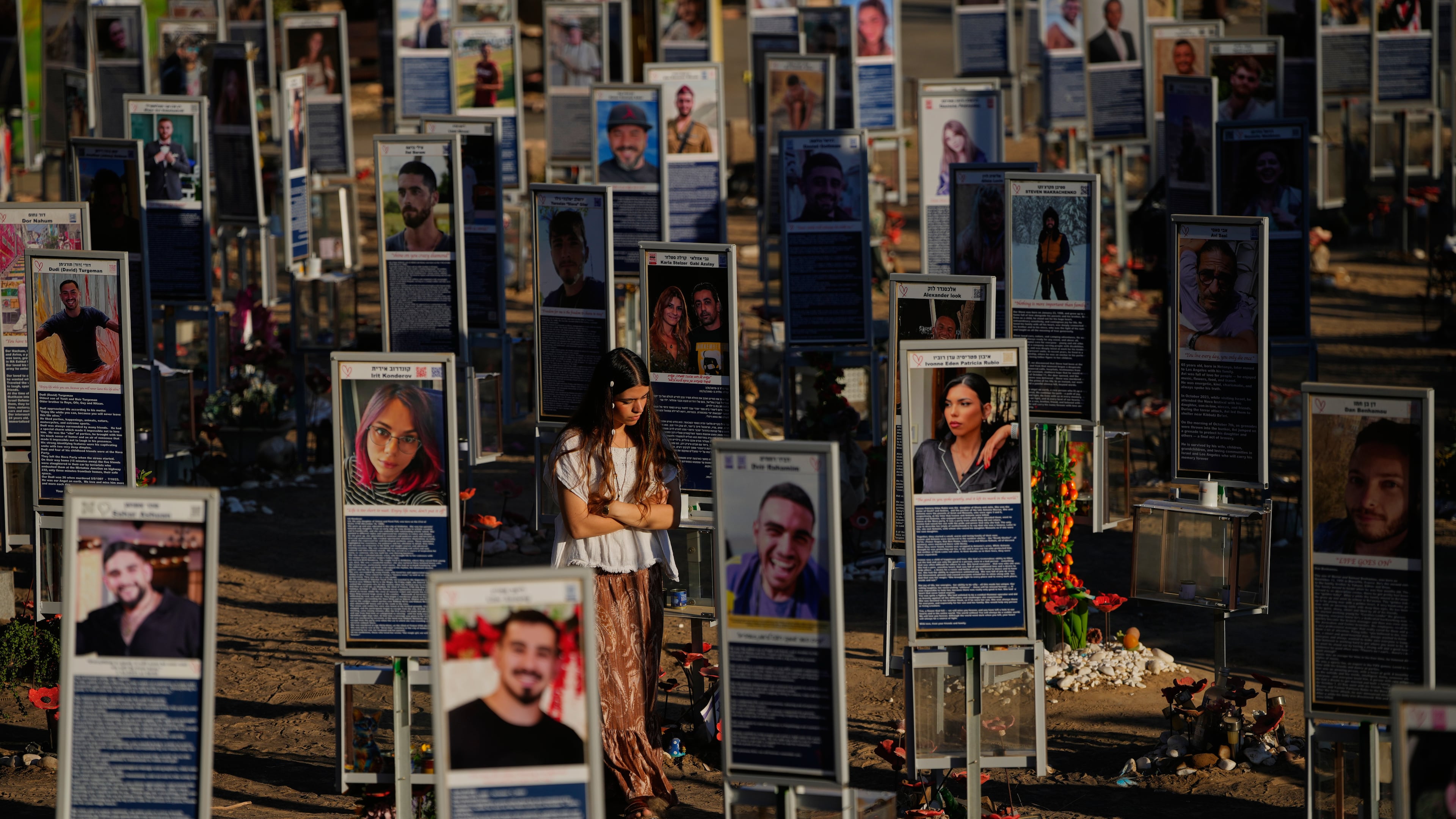 People mark the third anniversary of the Oct. 7, 2023, Hamas attack on Israel at the site of the Nova music festival, where hundreds of revelers were killed and abducted, near Kibbutz Reim, southern Israel, Wednesday, Oct. 7, 2026. (AP Photo/Ohad Zwigenberg)