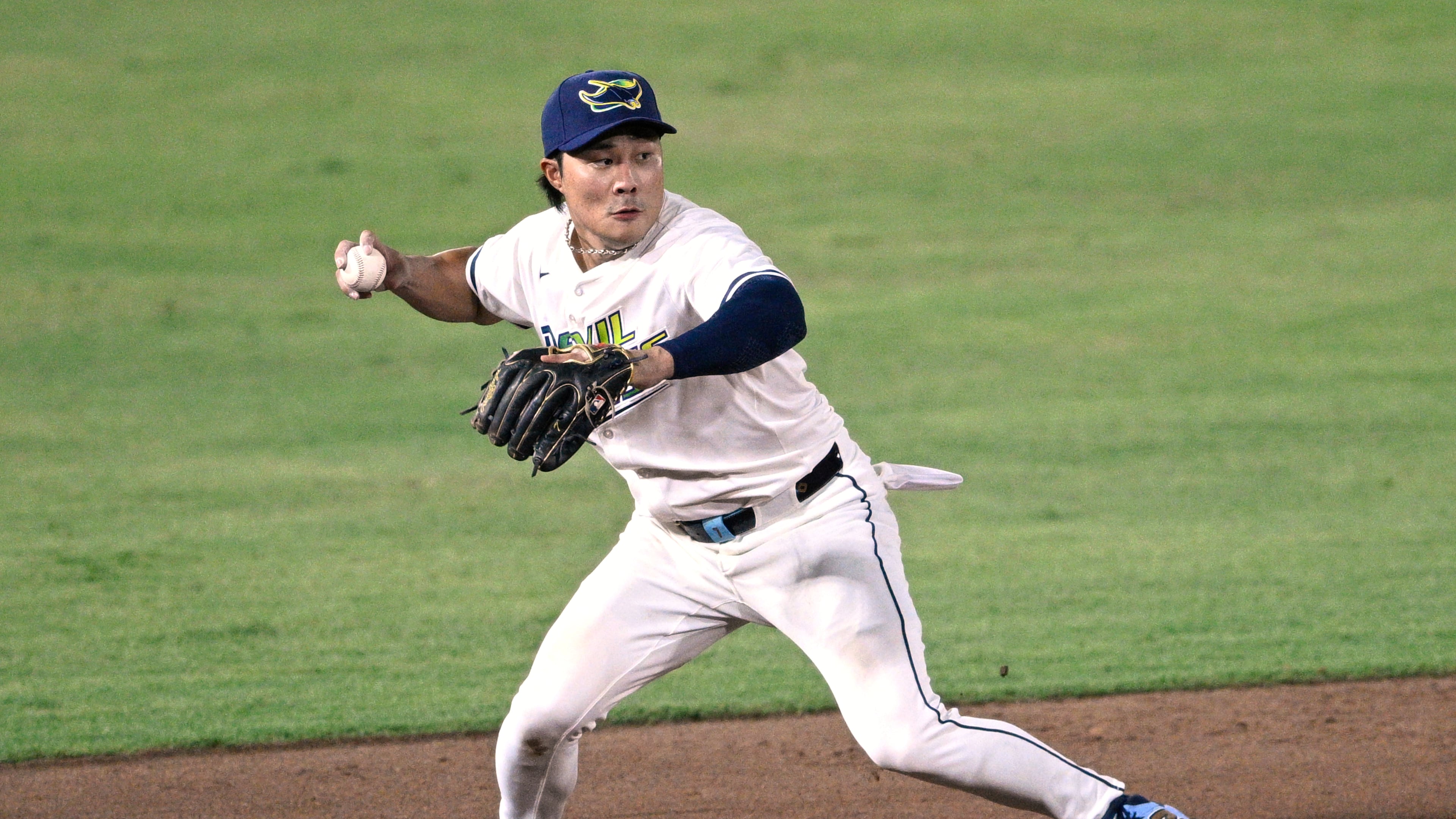 FILE - Tampa Bay Rays shortstop Ha-Seong Kim throws to first base after fielding a ground ball during the eighth inning of a baseball game against the Baltimore Orioles, July 19, 2025, in Tampa, Fla. (AP Photo/Phelan M. Ebenhack, File)