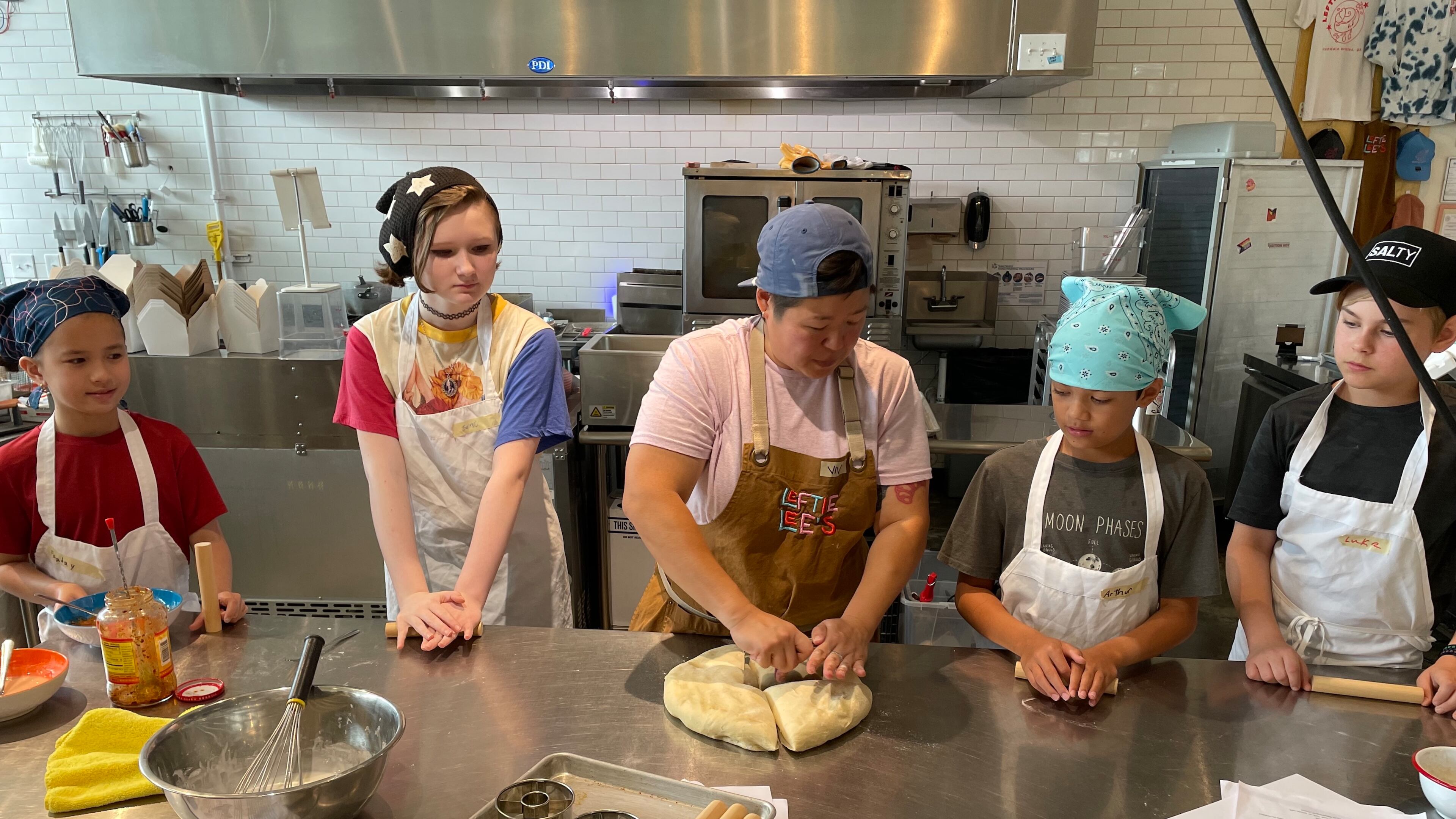Chef Vivian Lee (center) launched a summer camp program at her Avondale Estates restaurant Leftie Lee’s to spark an interest in food among young children. (Courtesy of Leftie Lee's)