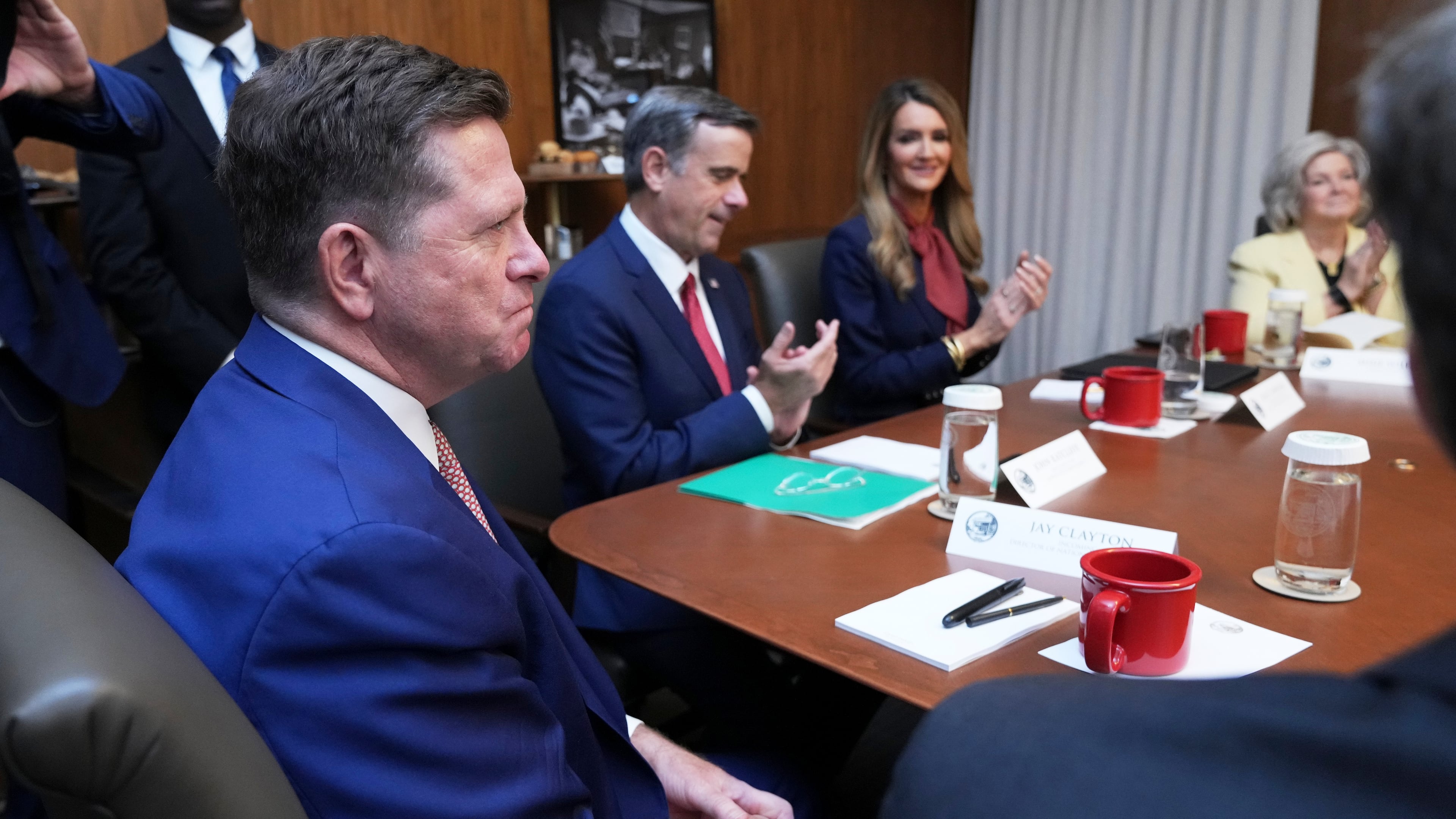 Jay Clayton, left, listens during a cabinet meeting, Friday, July 31, 2026, at Camp David, the presidential retreat, near Thurmont, Md., Friday, July 31, 2026. (AP Photo/Jacquelyn Martin)