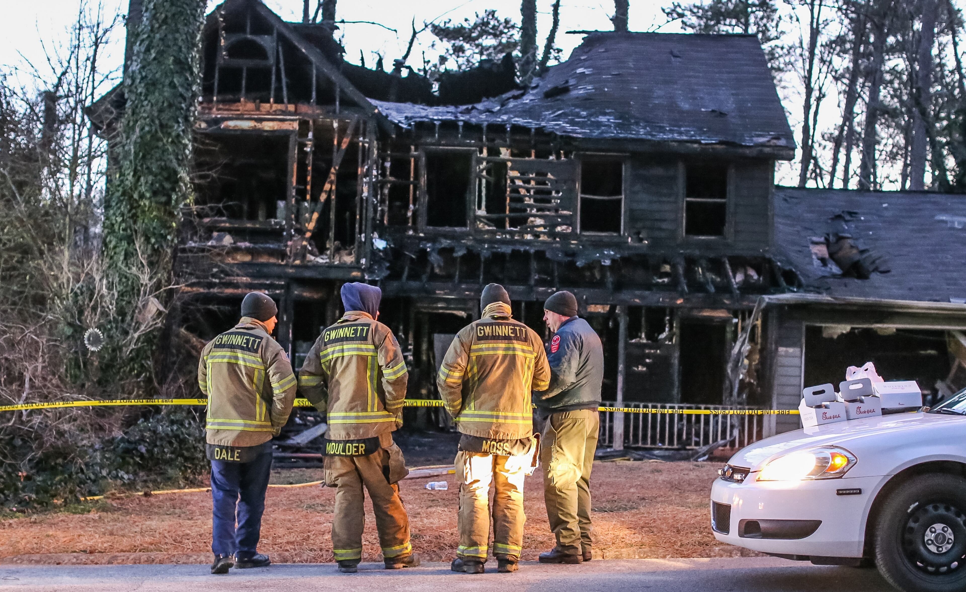 A fire that led to the deaths of a mother and her two daughters had demolished much of the home by Wednesday, Feb. 10, 2016. JOHN SPINK / JSPINK@AJC.COM