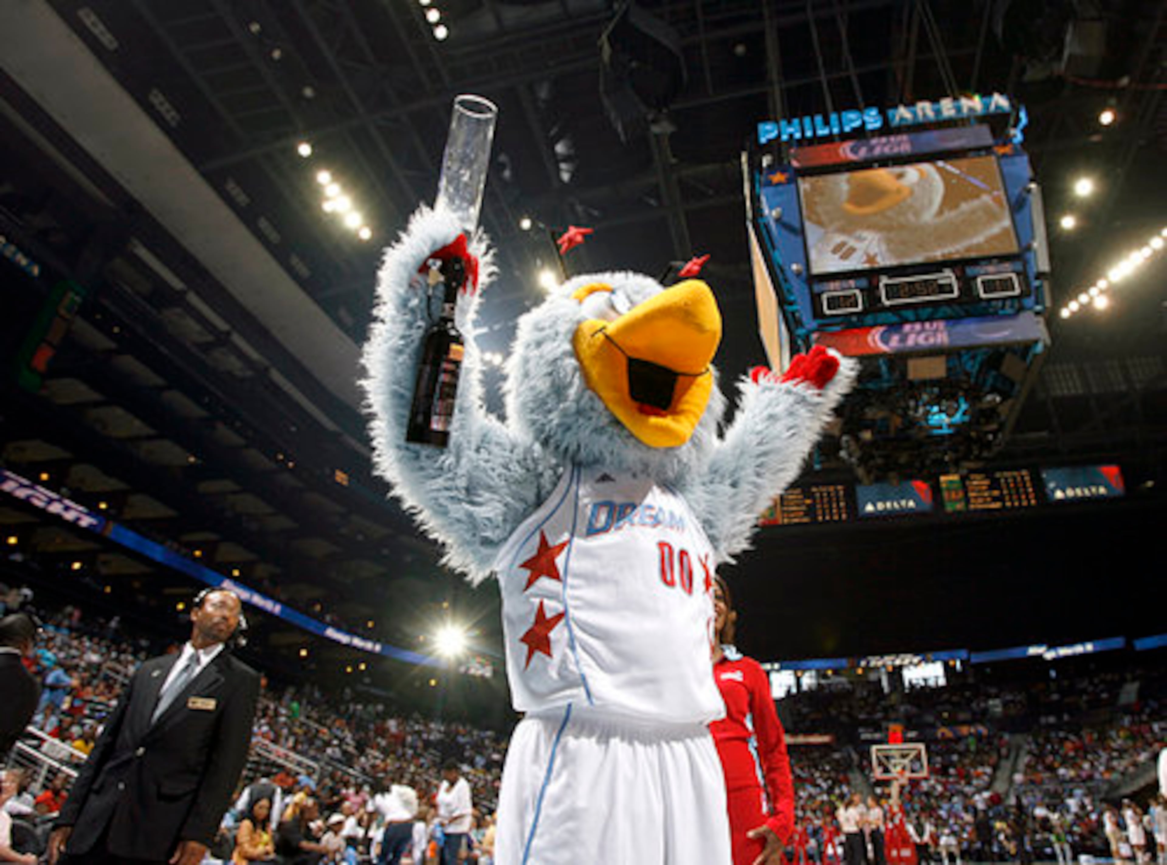 Atlanta Dream mascot Star rallies the crowd during a 2020 home game, a reminder of a team identity the franchise has yet to replace. (Allen Sullivan/AJC)