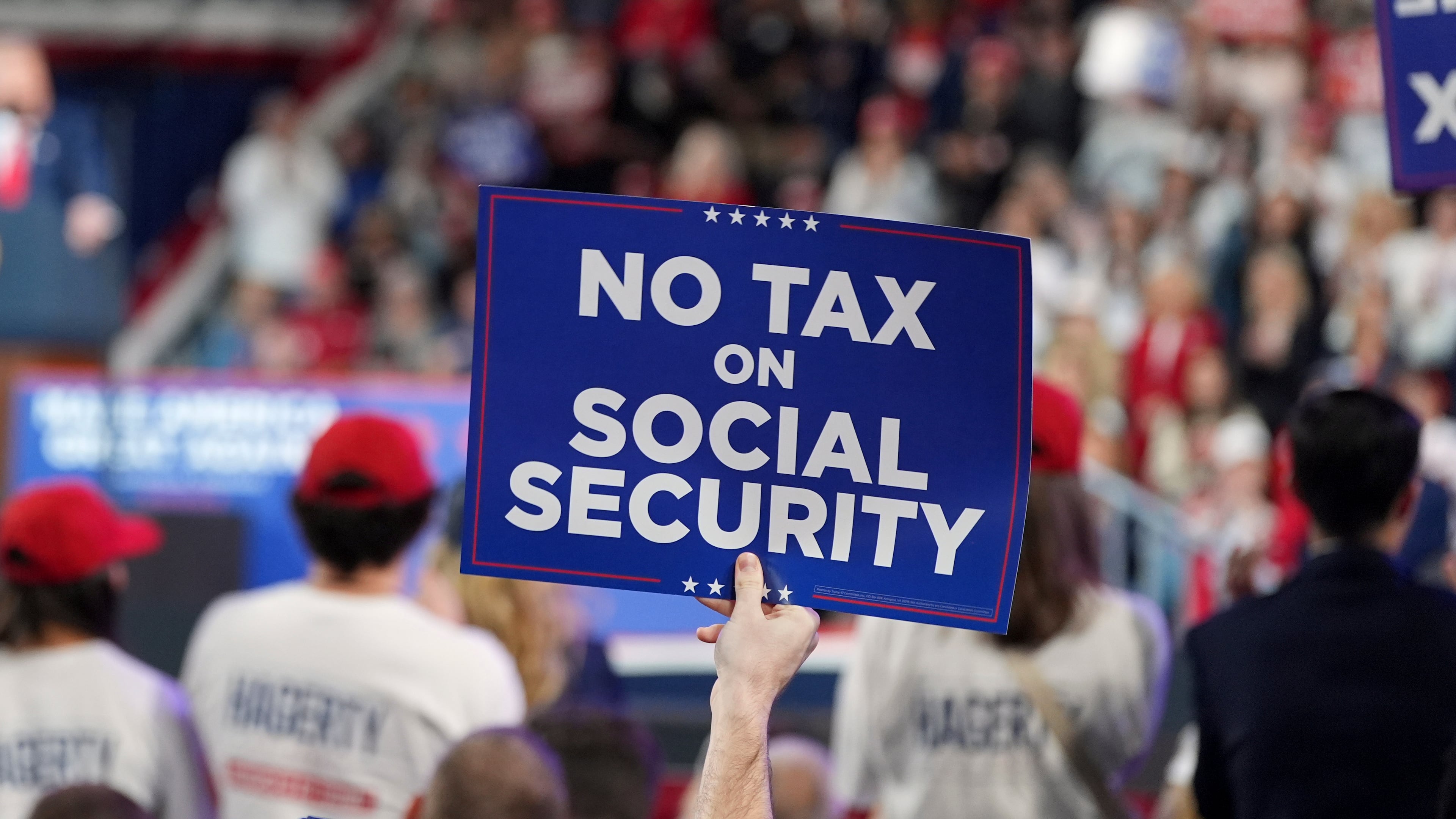 An attendee holds a sign as President Donald Trump speaks at a campaign rally at F&M Bank Arena, Saturday, Oct. 10, 2026, in Clarksville, Tenn. (Alex Brandon/AP)