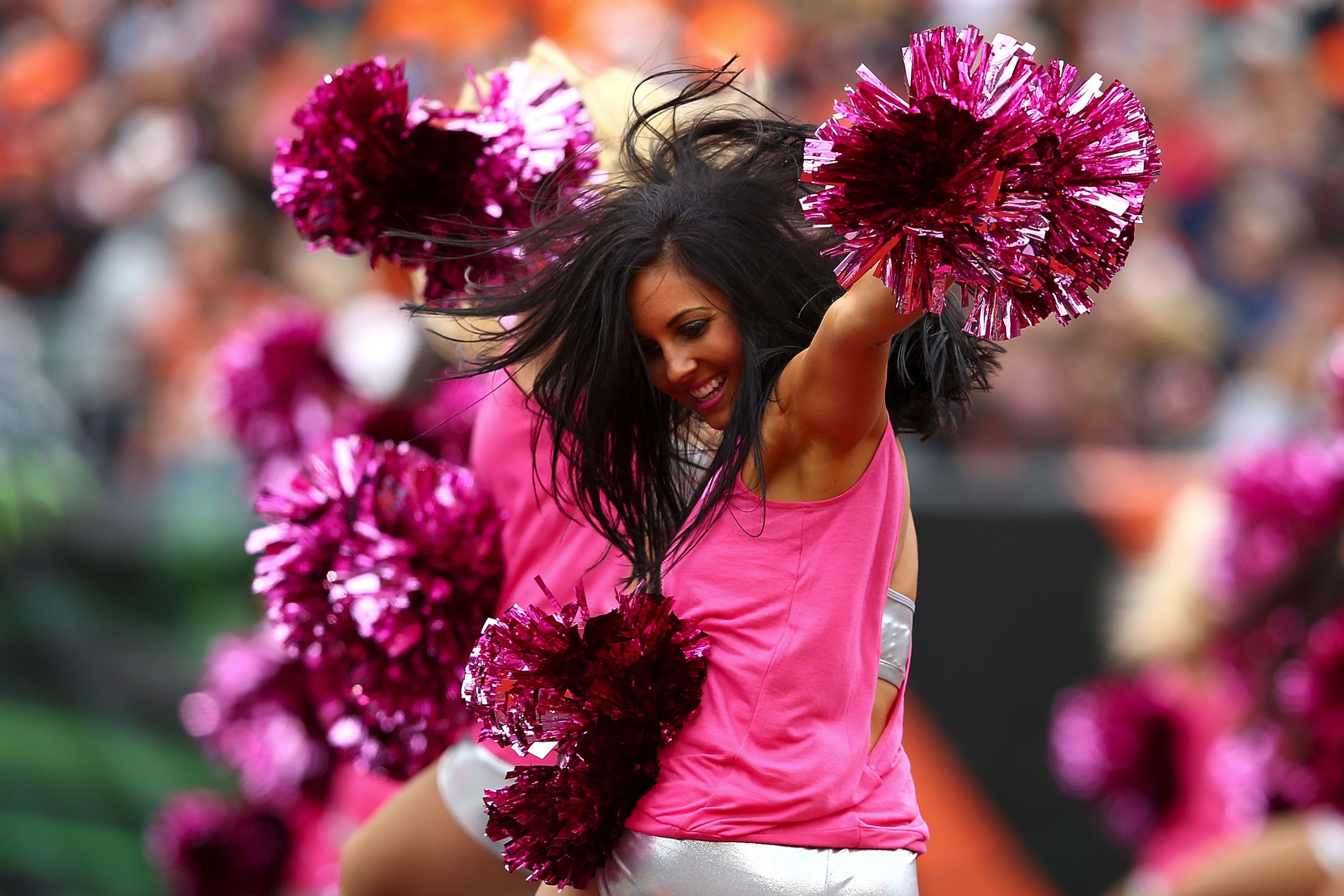 A member of the Cincinnati Bengals cheerleading squad dances in the end zone during the break between the first and second quarters during the game between the Cincinnati Bengals and the Carolina Panthers at Paul Brown Stadium on Oct, 12, 2014, in Cincinnati, Ohio. (Photo by Andy Lyons/Getty Images)
