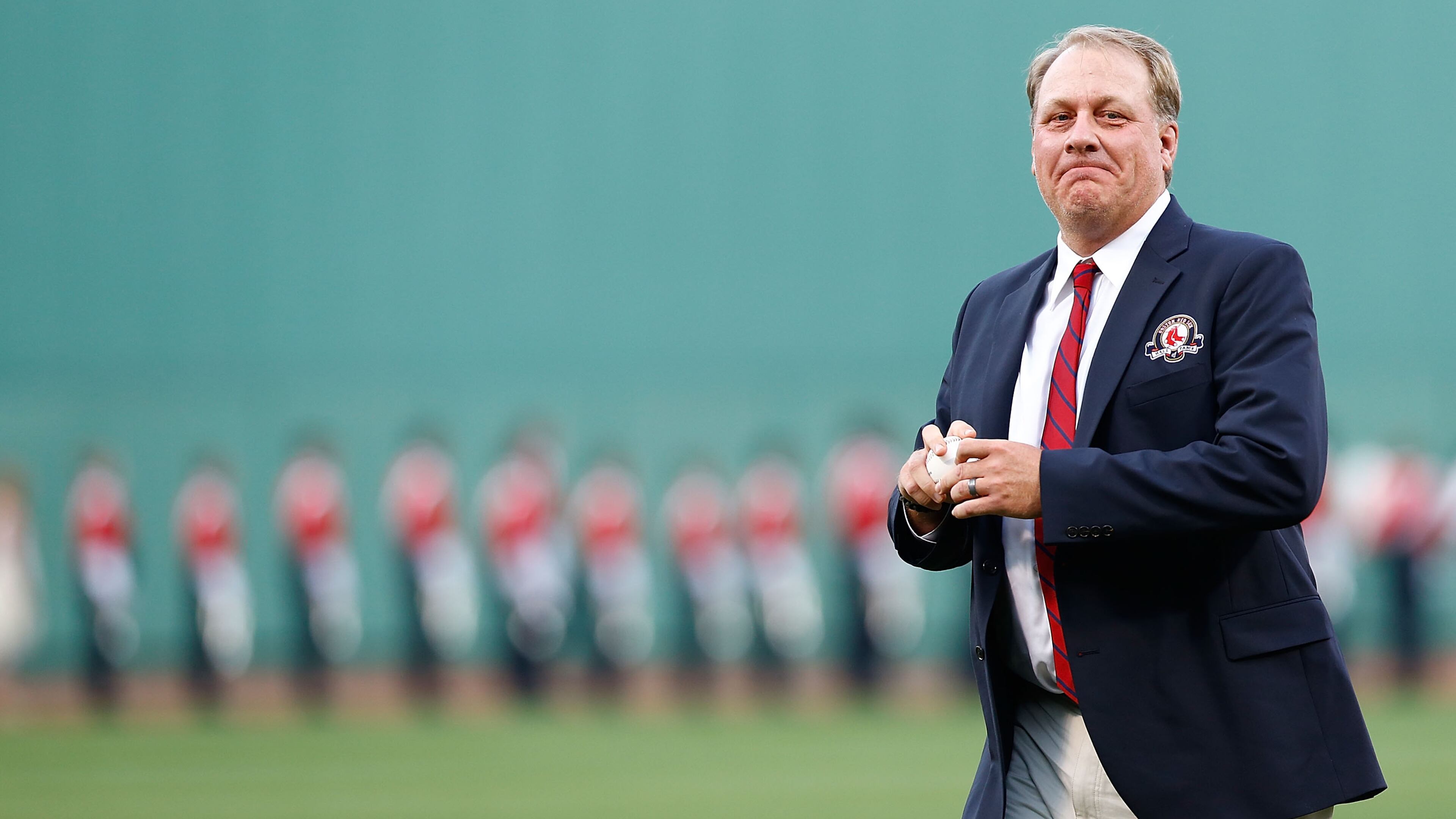 BOSTON, MA - AUGUST 03: Former Boston Red Sox pitcher Curt Schilling #38 throws out the first pitch after being inducted into the Red Sox Hall of Fame prior to the game against the Minnesota Twins during the game on August 3, 2012 at Fenway Park in Boston, Massachusetts. (Photo by Jared Wickerham/Getty Images)