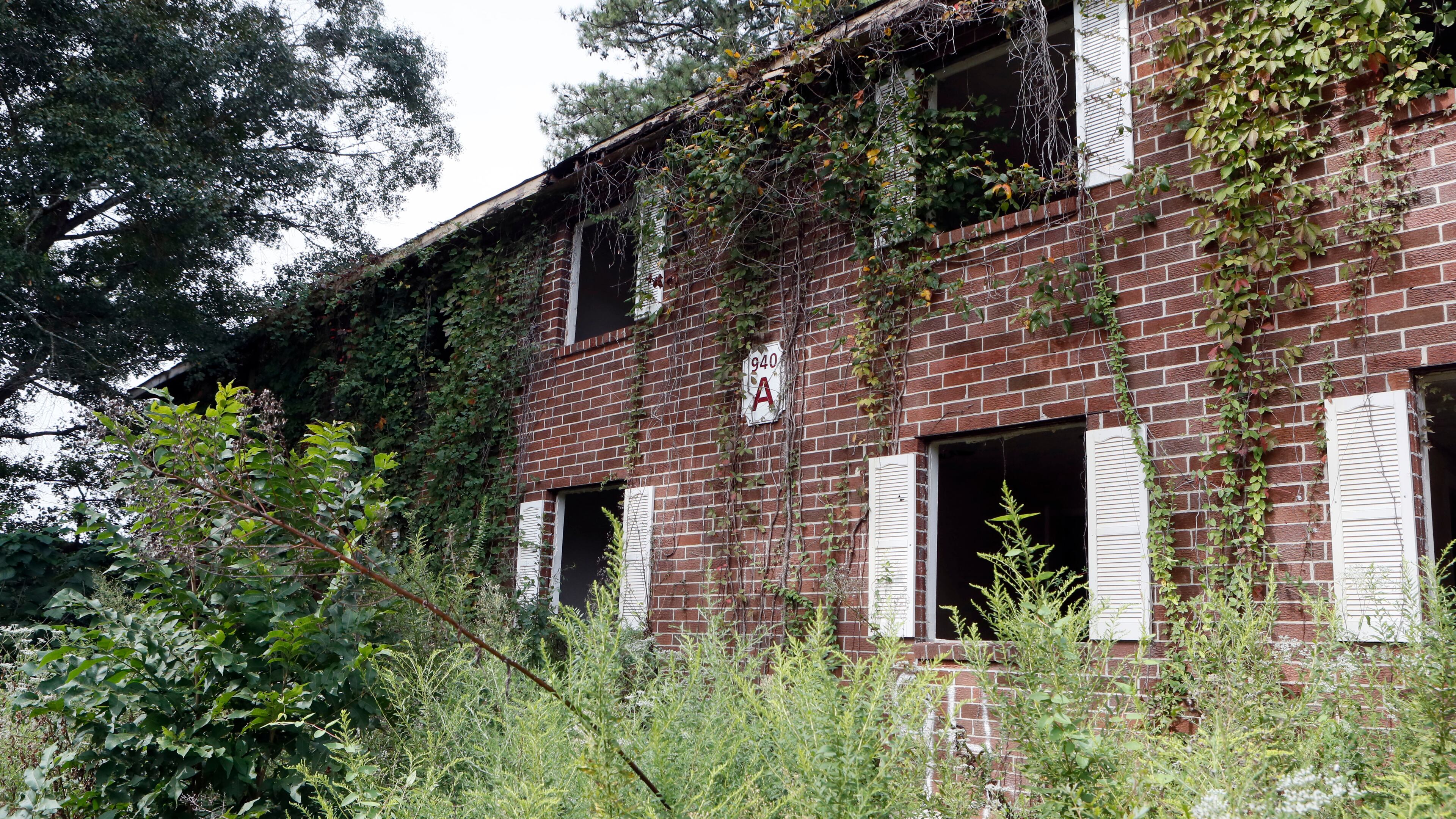 9/5/18 - Atlanta - Most of the windows were broken out of the blighted apartments and they were filled with trash. Then- Mayor Keisha Lance Bottoms, Councilmember Dustin Hillis, District 9, and Councilmember Andrea Boone, District 10, were on hand for the launch of the next phase of the mayor's "Fight the Blight" initiative with the demolition of several blighted apartments on Bolton Road. BOB ANDRES /BANDRES@AJC.COM