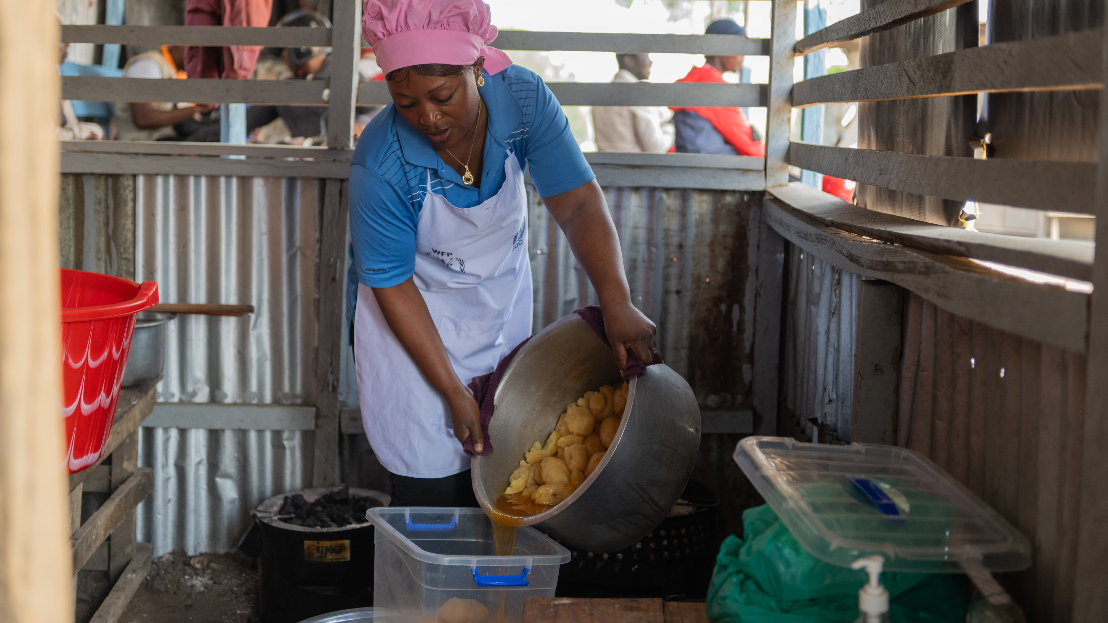 Arlette Basekawike prepares meals for Ebola patients at the Evangelical Medical Center (CEM) in Bunia, Congo, Monday, June 1, 2026. (AP Photo/Moses Sawasawa)