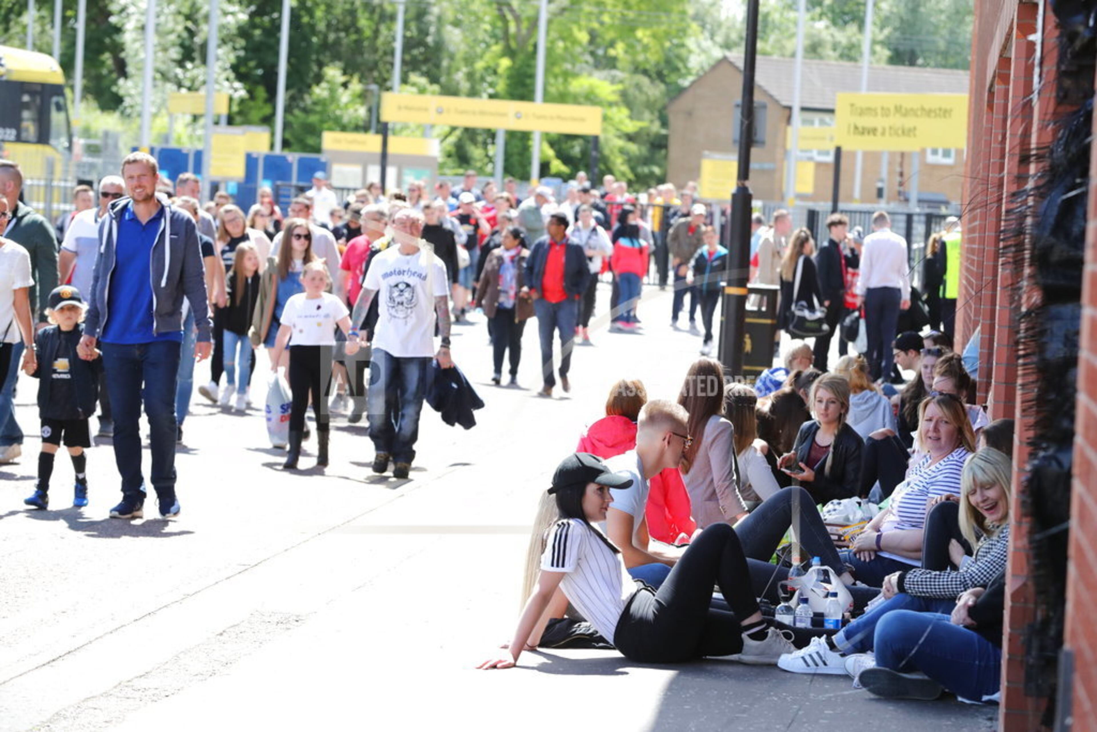 Crowds arrive to attend the One Love Manchester benefit concert Sunday June 4, 2017, for the victims of last month's Manchester Arena terror attack at the Emirates Old Trafford, Manchester, England. The attack at Ariana Grande's concert last week killed over 20 people and injured dozens of others, many of them teenagers. The singer returned to Britain on Friday ahead of the concert to benefit victims and their families. (Owen Humphreys/PA via AP)