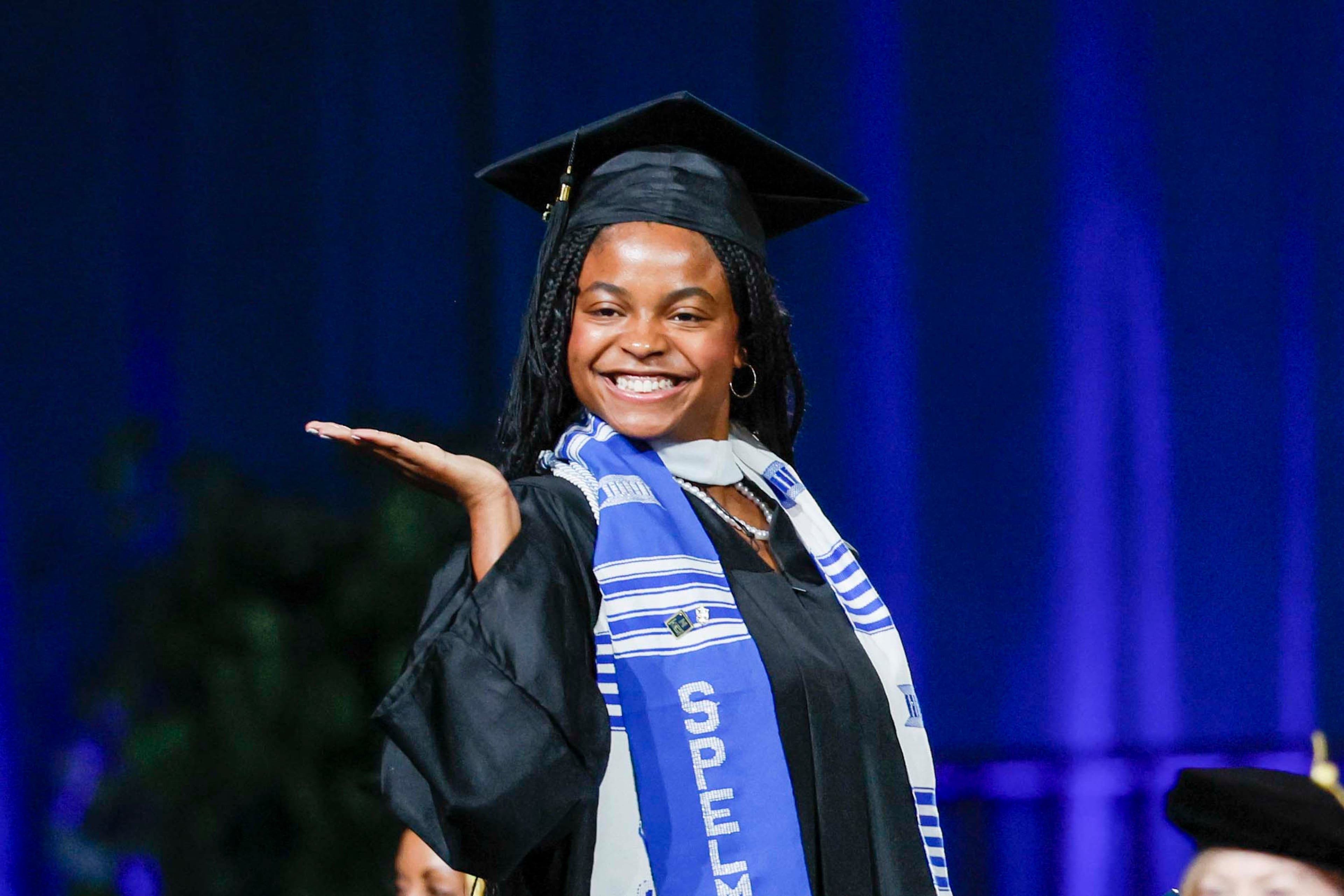 A graduate reacts after receiving her diploma during the Spelman College Commencement at the Georgia International Convention Center in College Park on Sunday, May 17, 2026. (Miguel Martinez/AJC)