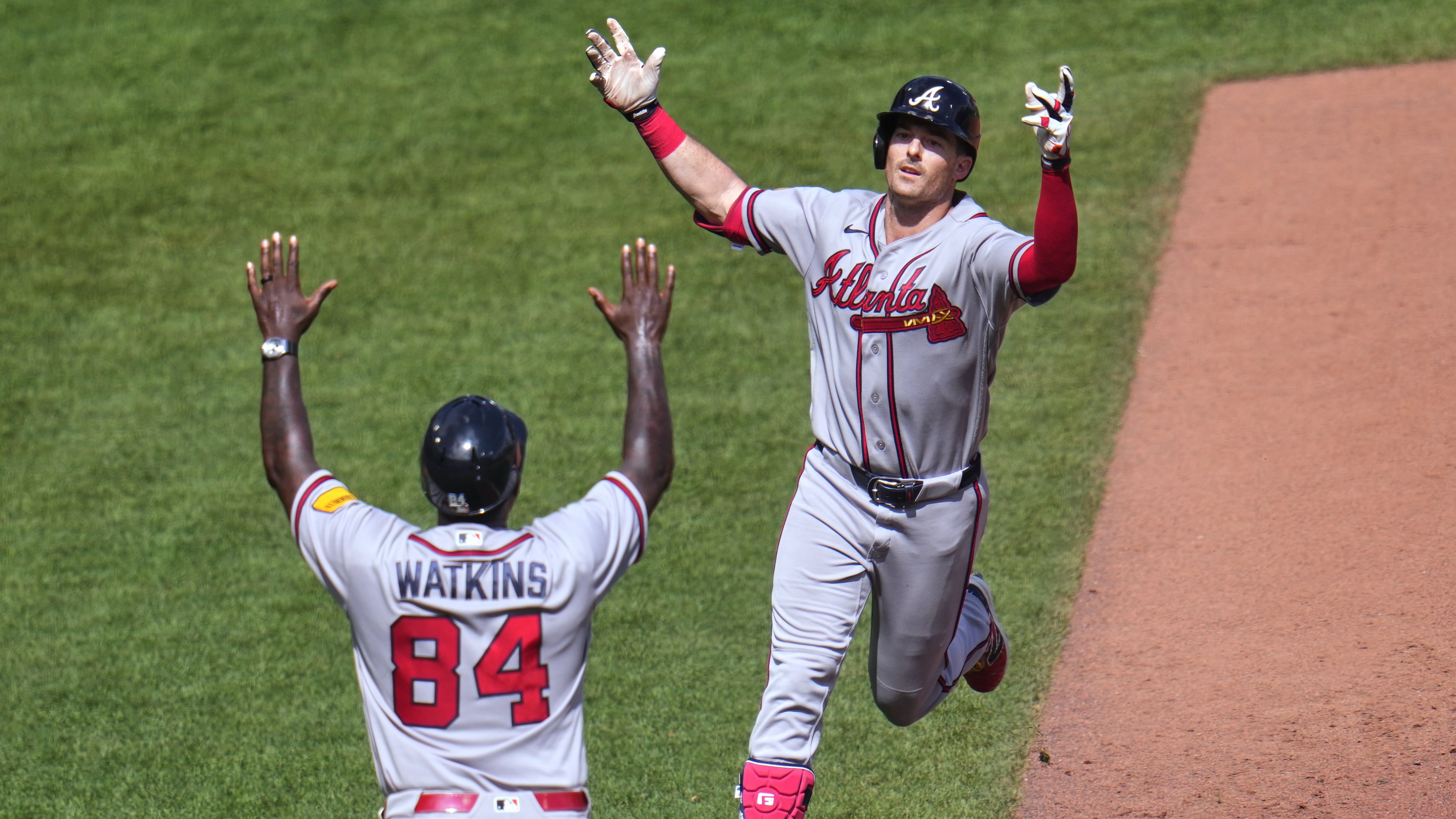 Braves outfielder Mike Yastrzemski (right) celebrates with third base coach Tommy Watkins after hitting a grand slam home run off Pirates pitcher Dennis Santana on Thursday, July 9, 2026, in Pittsburgh. Yastrzemski has been placed on the 10-day injured list. (Gene J. Puskar/AP)