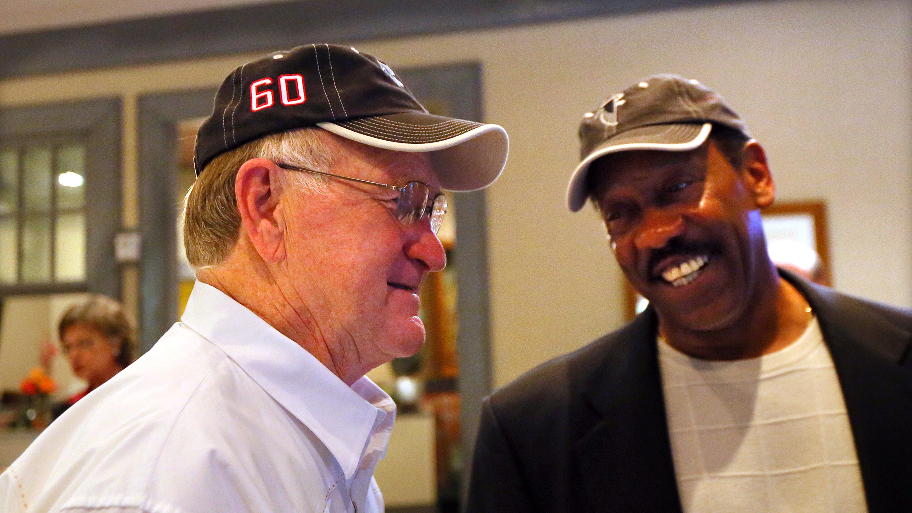 Falcons first-ever draft pick linebacker Tommy Nobis (left) shares a laugh with teammate safety Ray Brown during a reunion on Saturday, May 4, 2013, at Lake Lanier Islands Resort. CURTIS COMPTON / CCOMPTON@AJC.COM