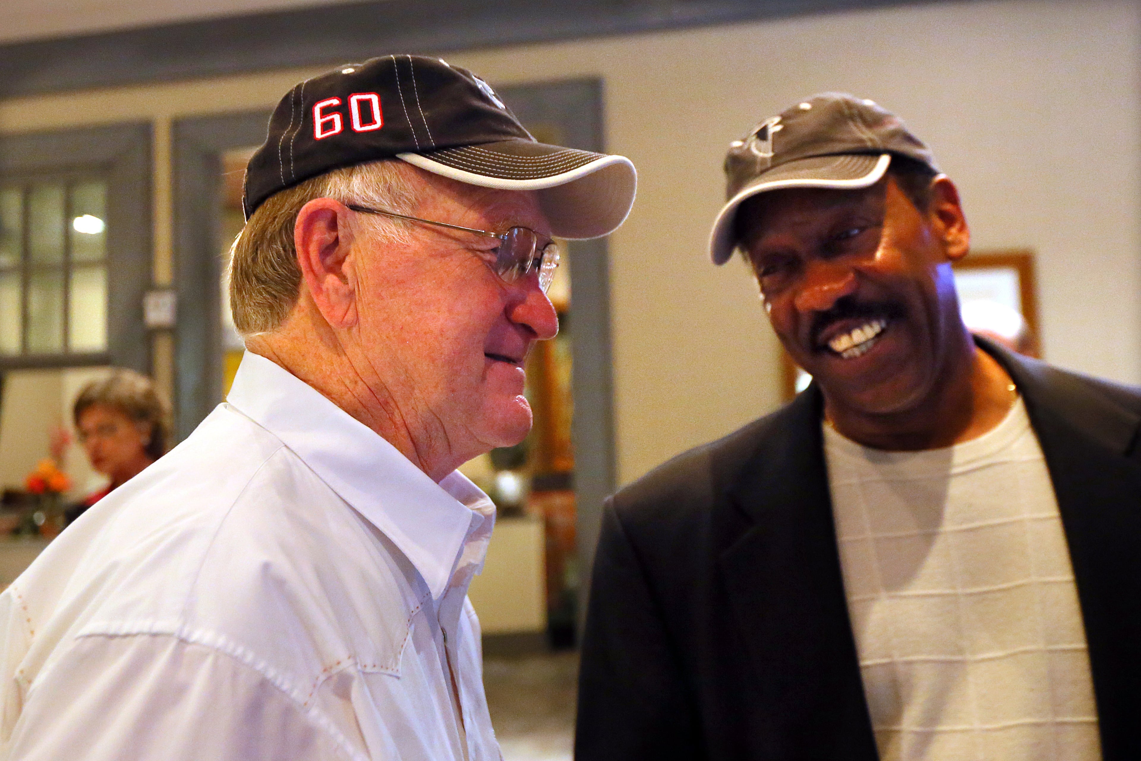 Falcons first-ever draft pick linebacker Tommy Nobis (left) shares a laugh with teammate safety Ray Brown during a reunion on Saturday, May 4, 2013, at Lake Lanier Islands Resort. CURTIS COMPTON / CCOMPTON@AJC.COM