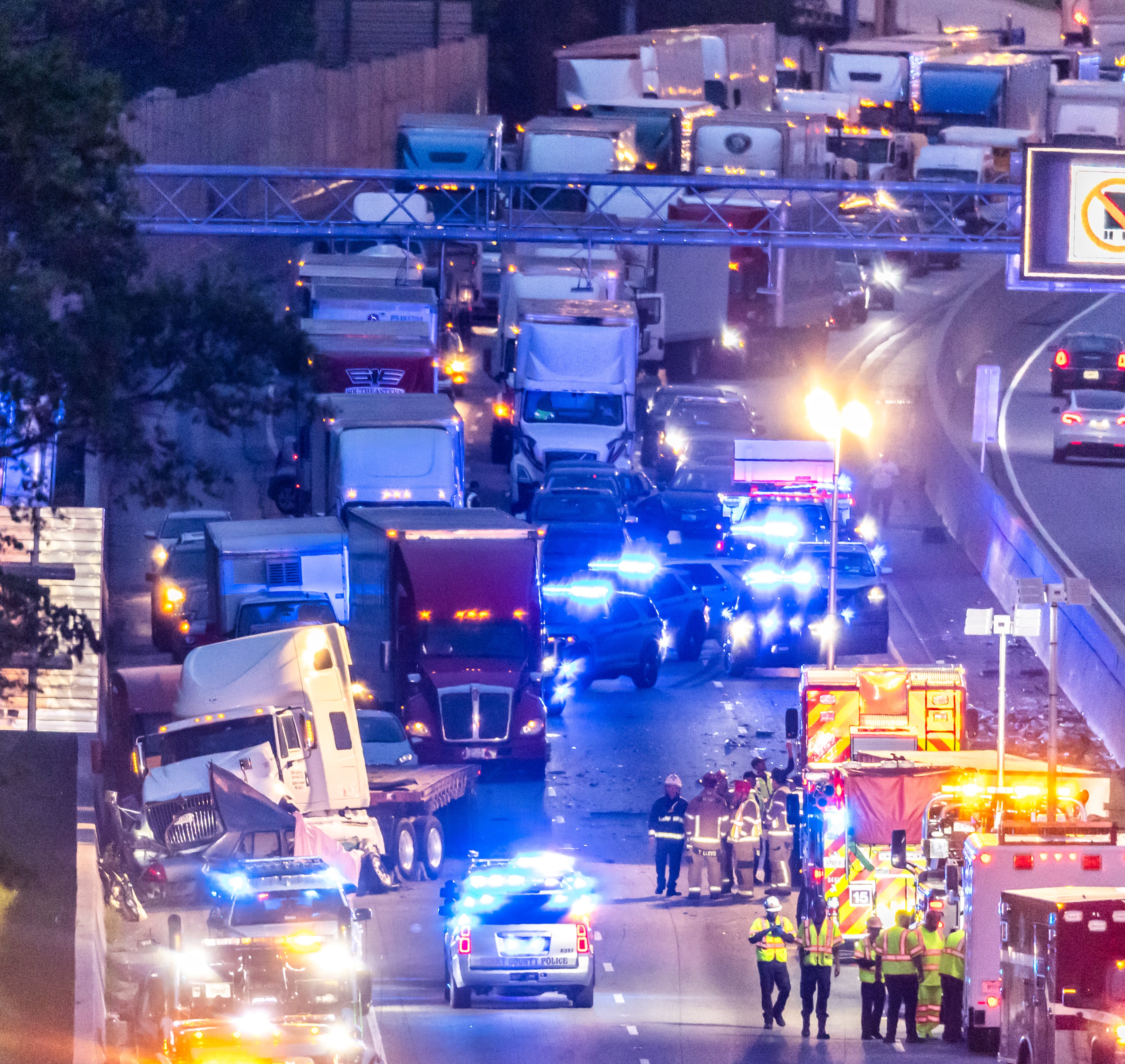 All lanes reopened on I-75 South in Henry County after a six hour investigation of a deadly crash involving multiple tractor-trailers that brought travel to a standstill Tuesday morning, April 16, 2024. The collision happened near mile marker 221, or just past Jodeco Road and before Jonesboro Road, at around 4:40 a.m., according to the Georgia Department of Transportation. The lanes were cleared by 11:20 a.m., GDOT stated, though traffic remains backed up for miles. Henry police confirmed at least one fatality. They did not release additional information about the extent of any other injuries. After the crash, a crane was used to lift a vehicle that appeared to have been pinned under one of the tractor-trailers. Several other big rigs remained on the shoulder of the interstate during the cleanup efforts. Police did not share details about what led to the wreck, as investigators processed the scene. Motorists were told to avoid the area. Backups extended for several miles, reaching I-675 as of 11:30 a.m. Commuters used U.S. 19/41, Ga. 42 and Ga. 155 as alternates, though traffic on those roads moved slowly, according to the WSB 24-hour Traffic Center. (Photo by John Spink/AJC)