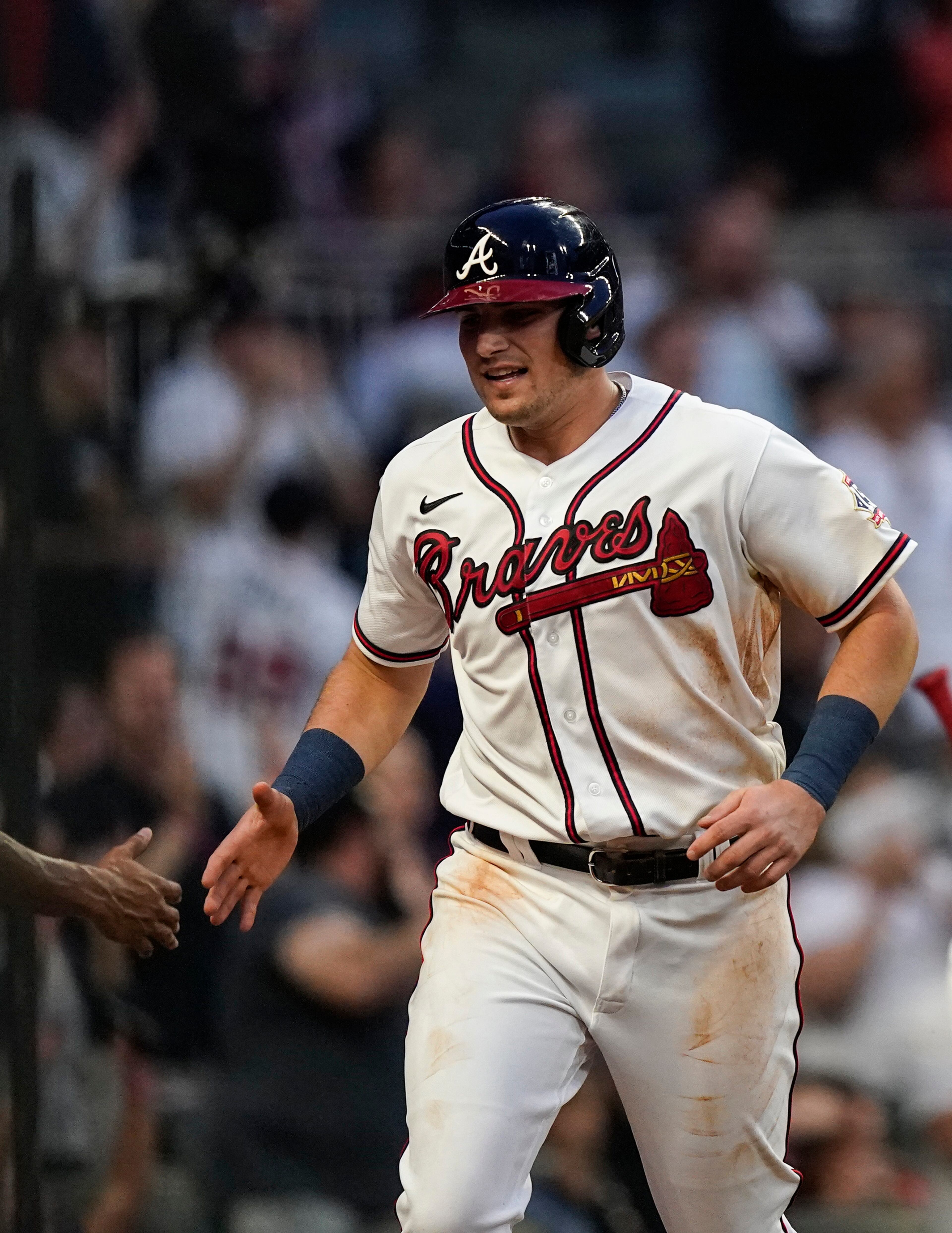 Atlanta Braves' Austin Riley celebrates after scoring in the third inning of a baseball game against the Los Angeles Dodgers, Saturday, June 5, 2021, in Atlanta. (AP Photo/Brynn Anderson)