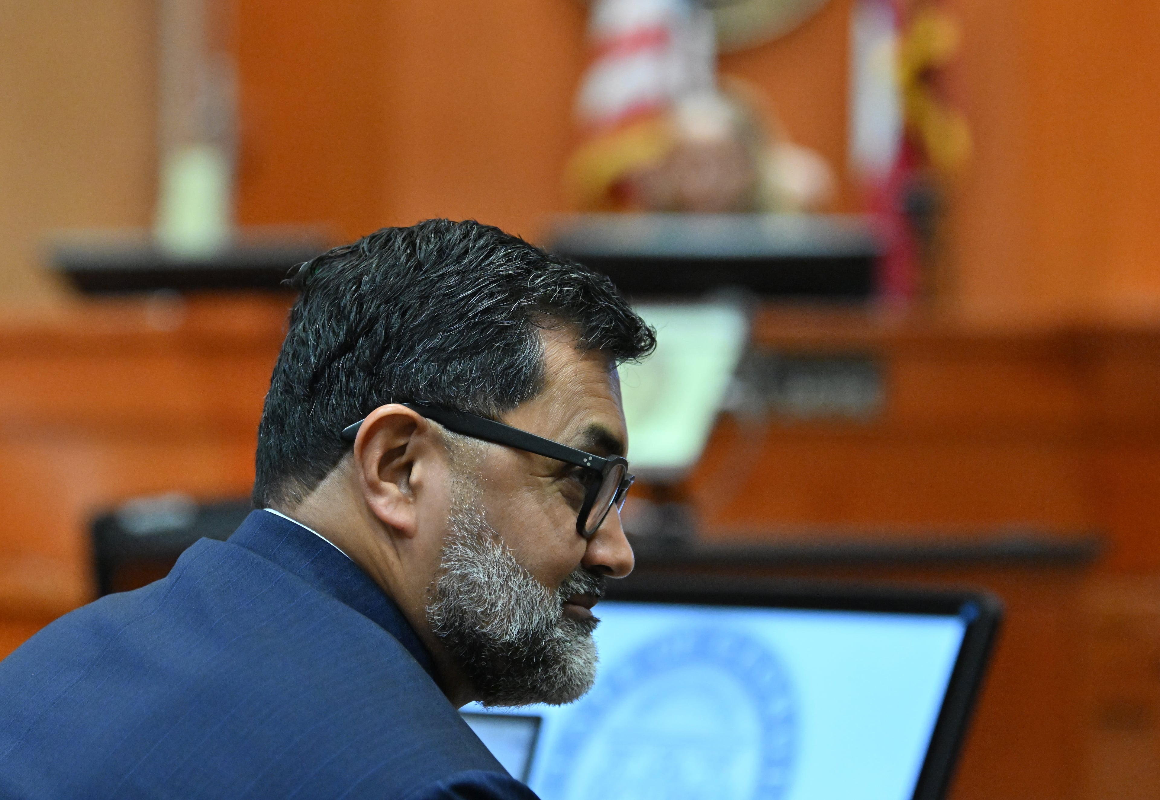 Manny Arora, attorney for Sumanth and Anindita Rao, looks toward his clients during a hearing at DeKalb County Courthouse in April 2026. (Hyosub Shin/AJC)