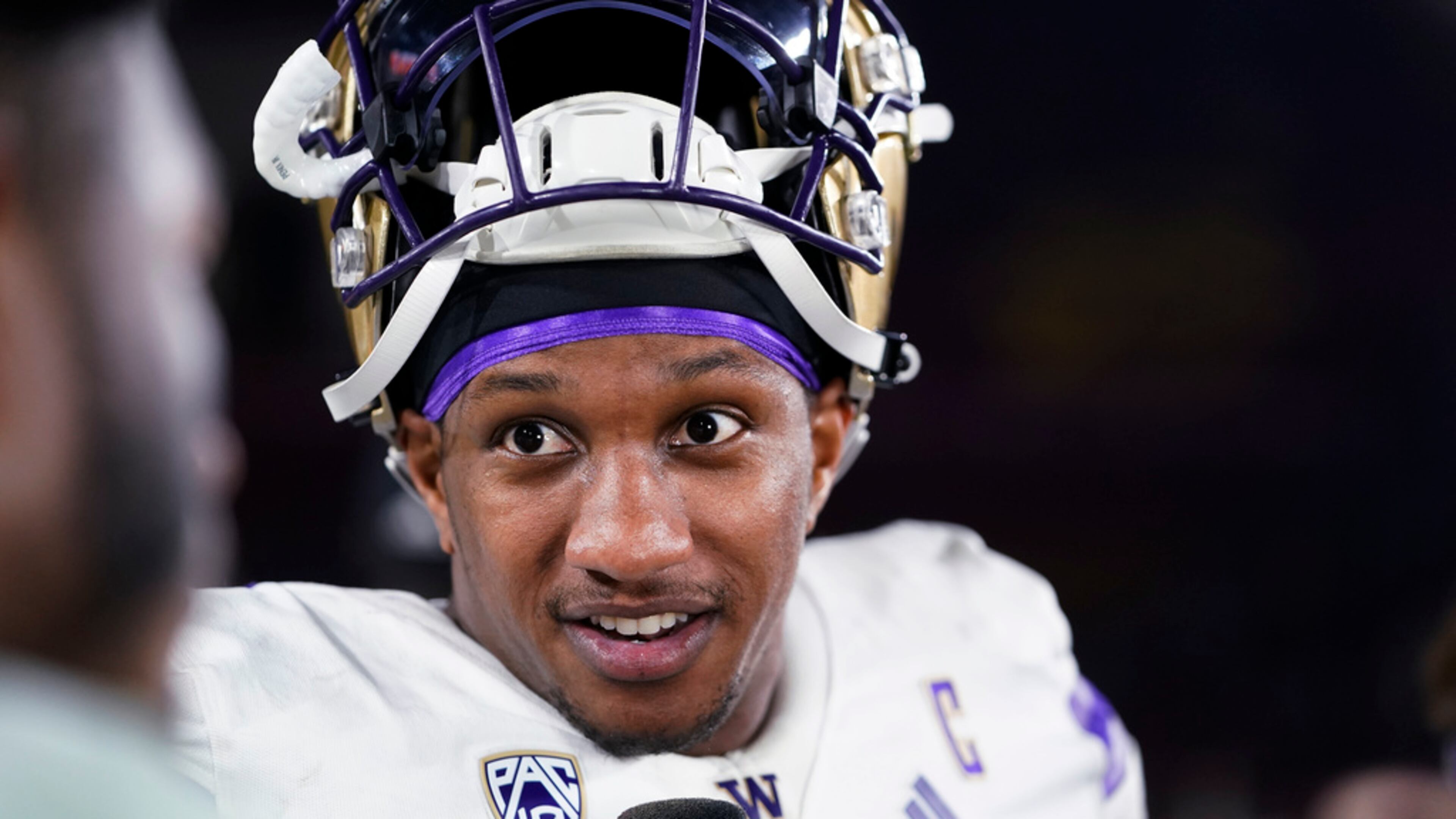 Washington quarterback Michael Penix Jr. is interviewed after the team's win over Southern California in an NCAA college football game, Saturday, Nov. 4, 2023, in Los Angeles. (AP Photo/Ryan Sun)