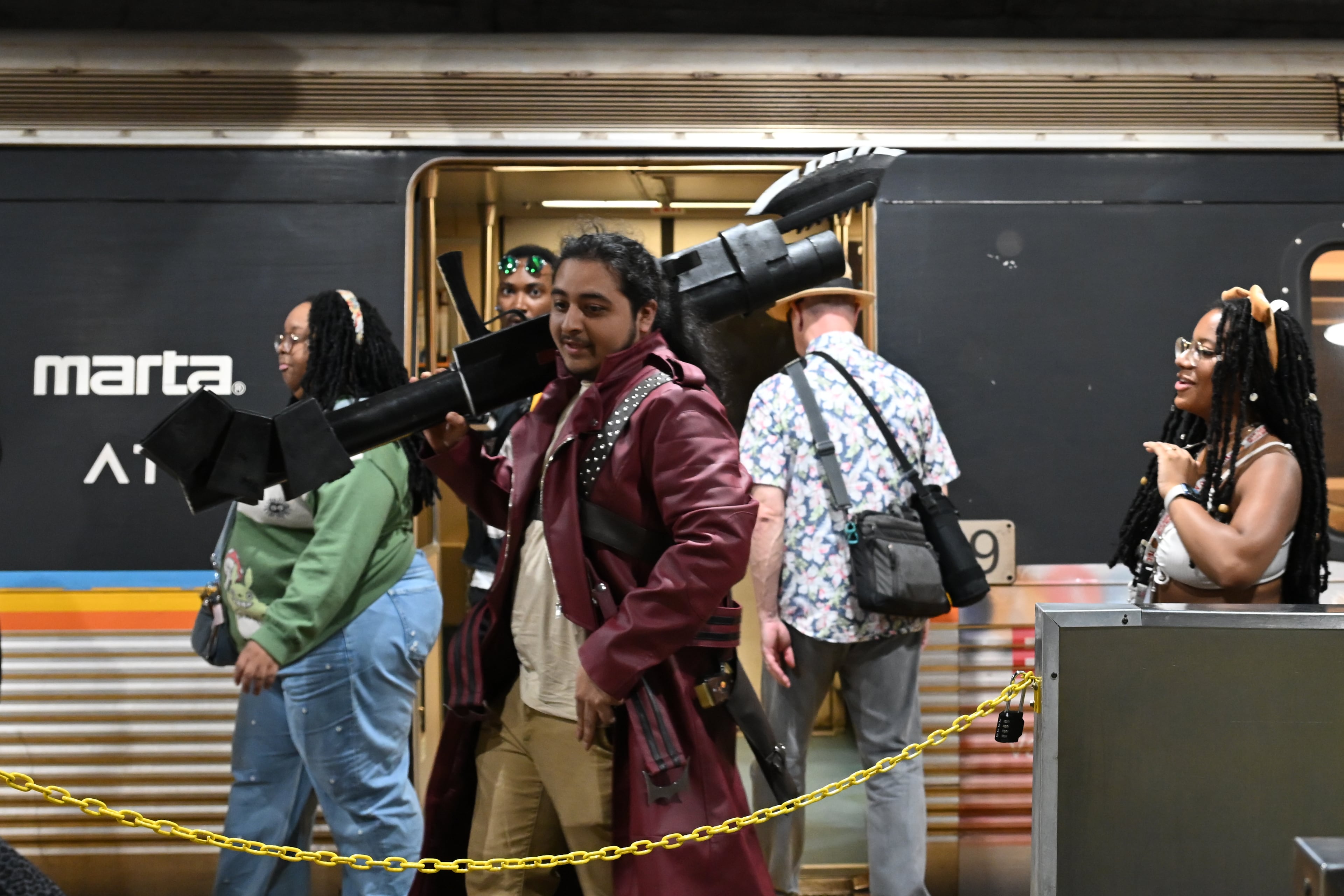 Momocon attendees exit a MARTA train in Atlanta on Friday, May 22, 2026. Momocon is an annual gaming, animation and art convention held at the Georgia World Congress Center. (Tyler Sun for the AJC)