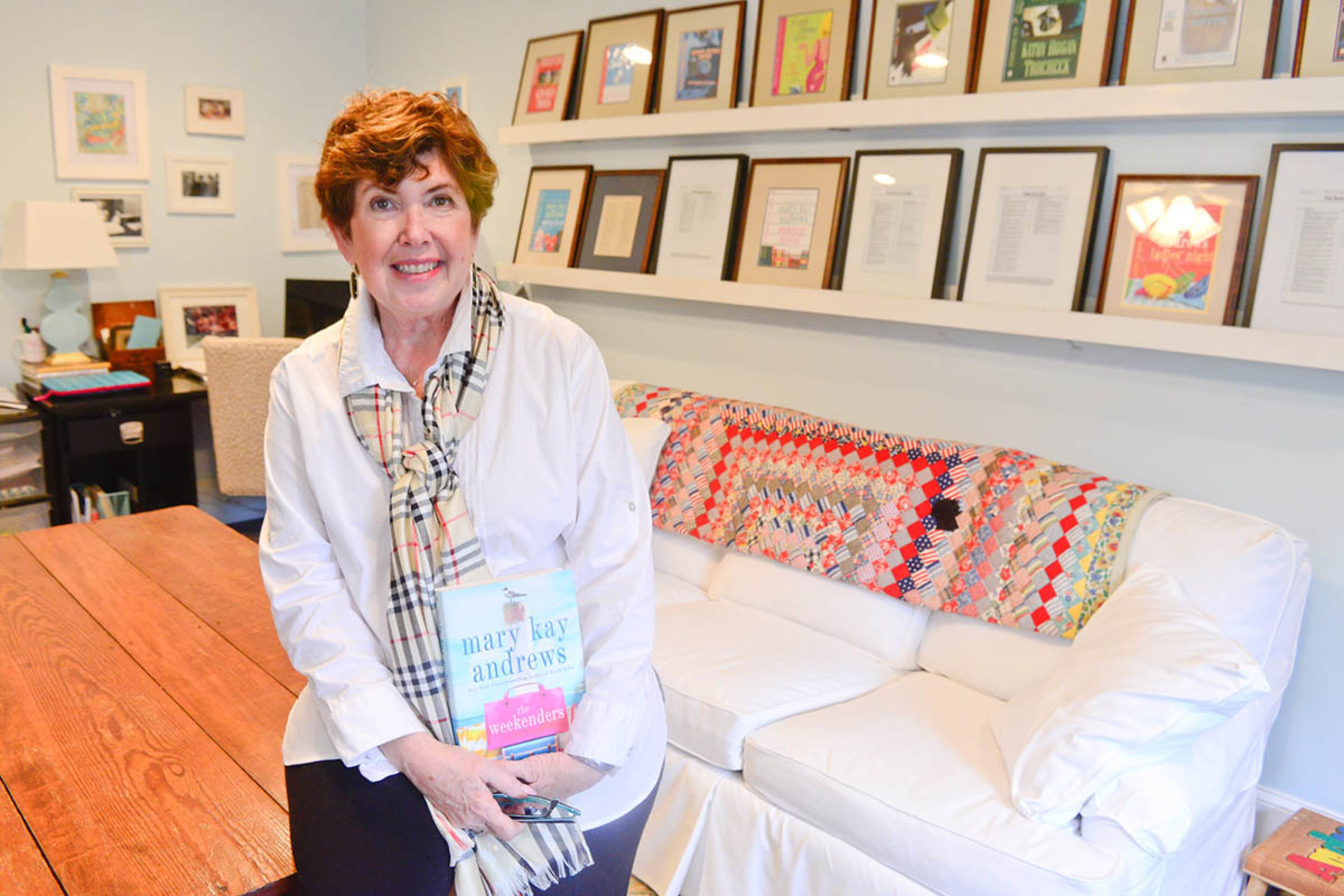In Kathy Hogan Trocheck's studio, some of her 24 book covers and New York Times best-seller lists are displayed. Her most recent book, "The Weekenders," written under her pen name, Mary Kay Andrews, came out in 2016, and "The Beach House Cookbook" is scheduled for release in 2017. The couch is a slipcovered estate sale find, made even more snuggly with a colorful quilt.