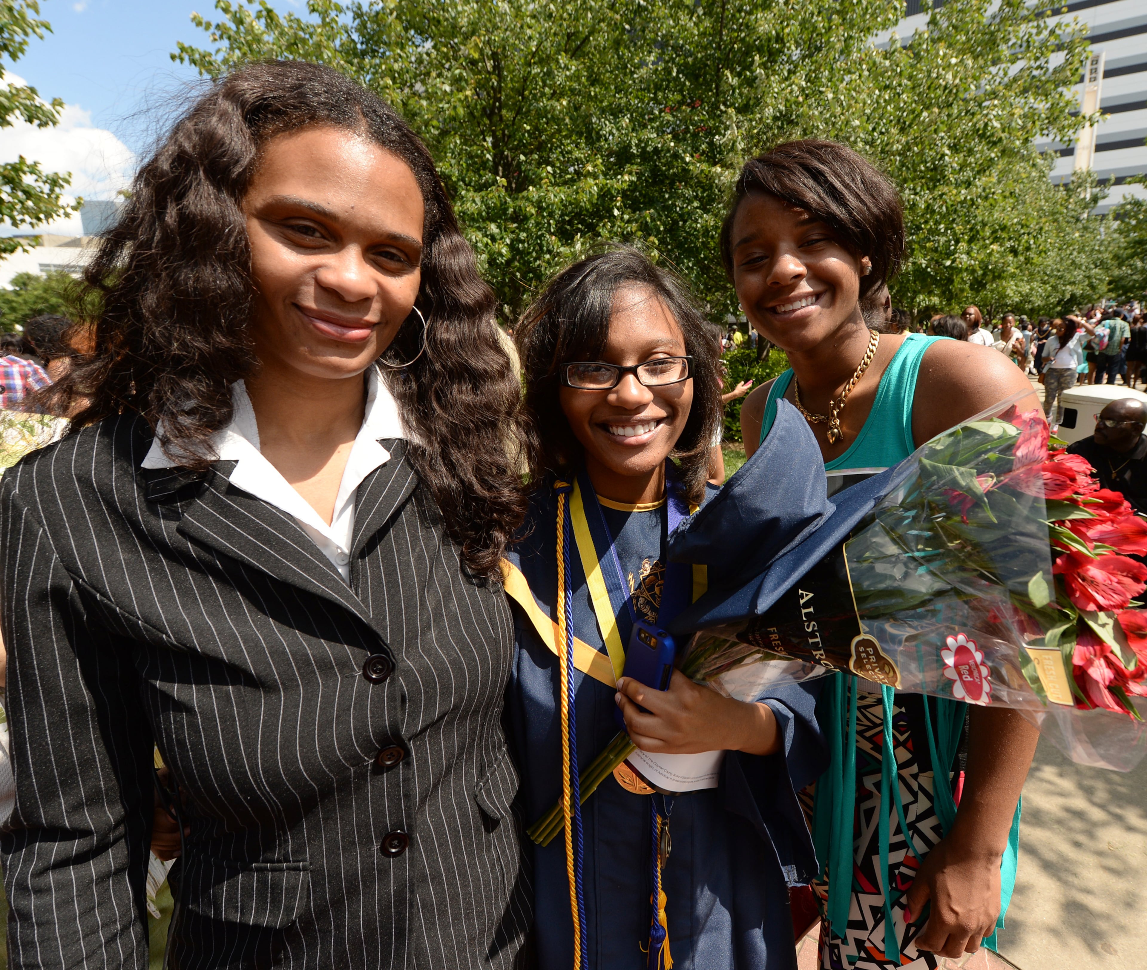 Reenita Shepherd and daughters, Chelesa Fearce, Valedictorian from Charles R Drew High School and Chelsea Shelton, Salutatorian of George Washington High School outside the Georgia Dome on Thursday ,May 23 2013.